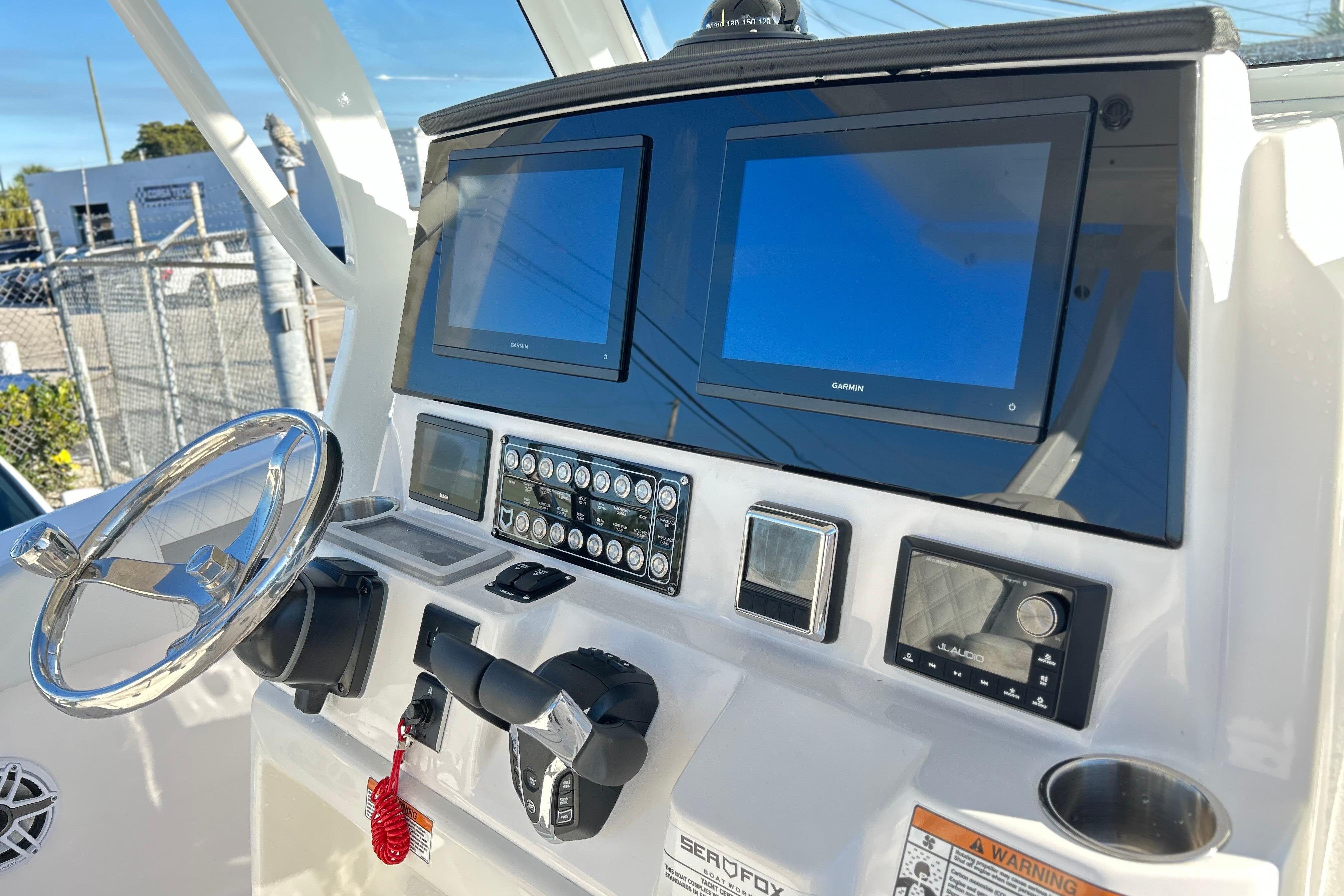 2026 Sea Fox 288 Commander dashboard with dual Garmin displays and steering wheel.