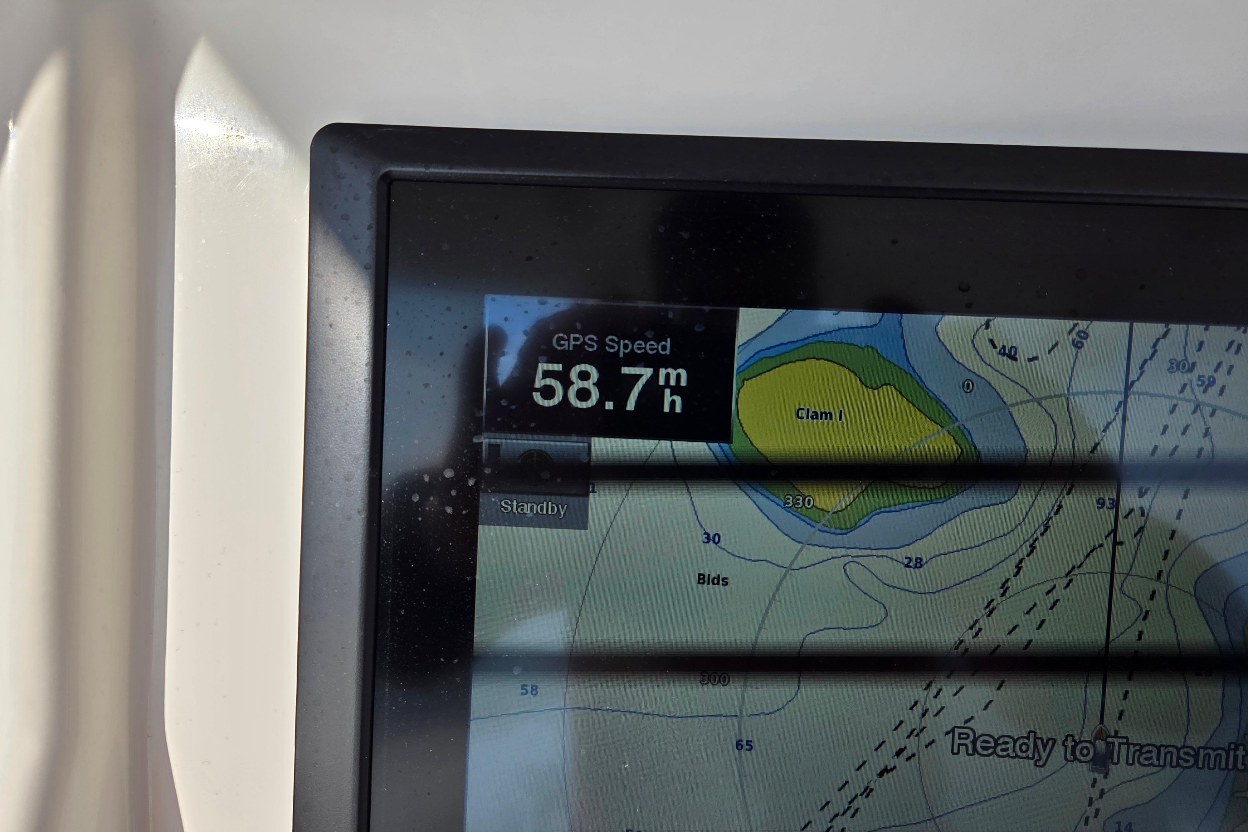 GPS display showing speed of 58.7 mph on 2015 Regulator 28 Forward Seating boat.