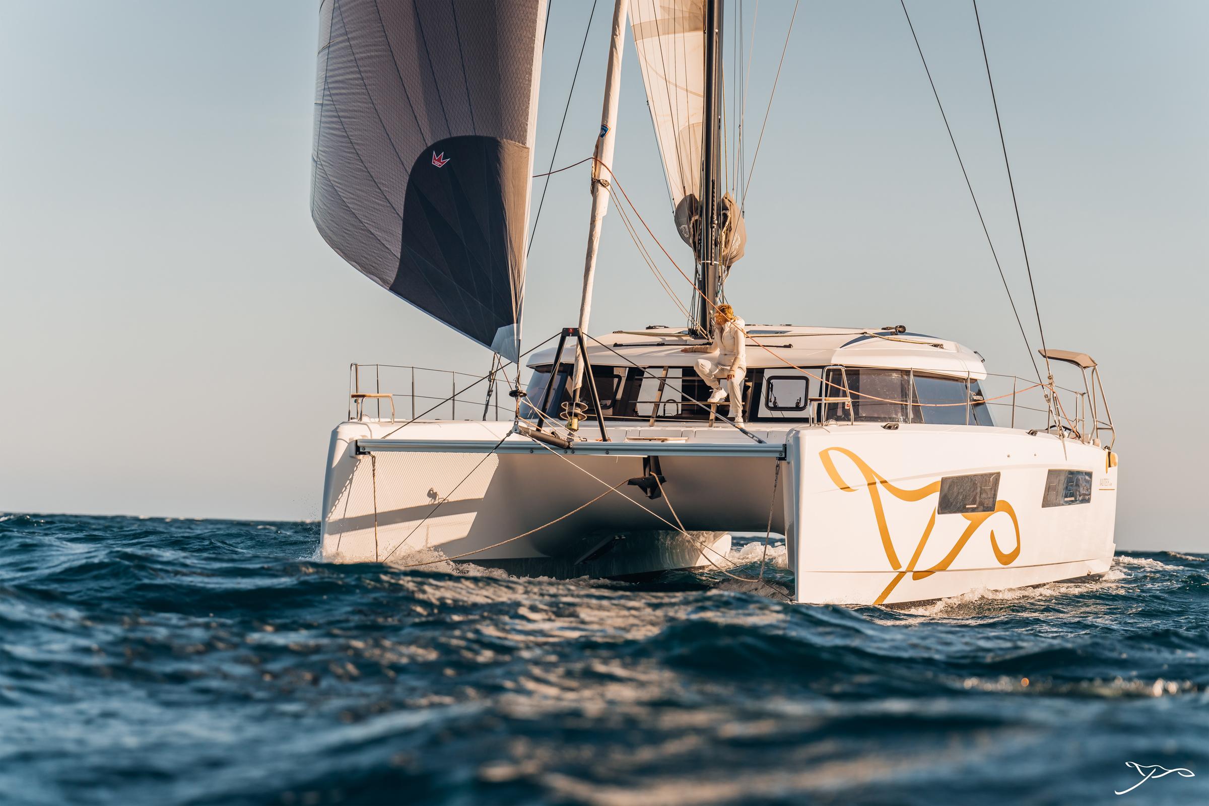 2025 Nautitech 44 Open catamaran sailing on open sea under clear skies.