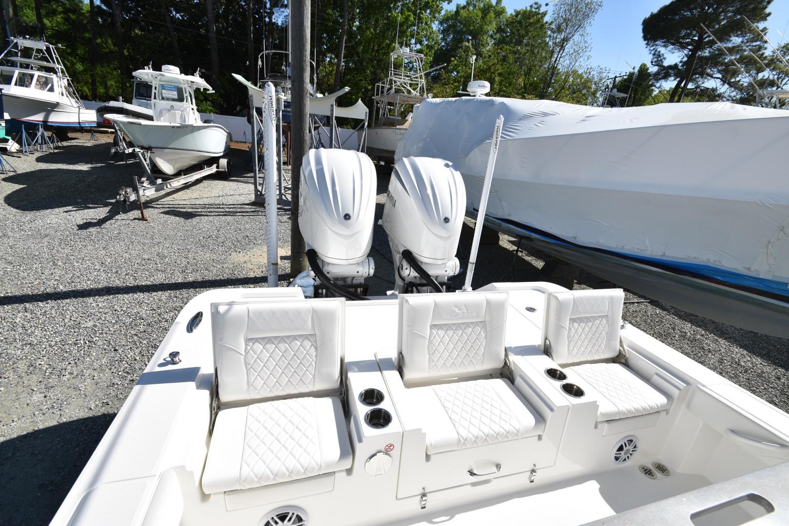 2023 Regulator 30XO Center Console with twin engines and white seating.