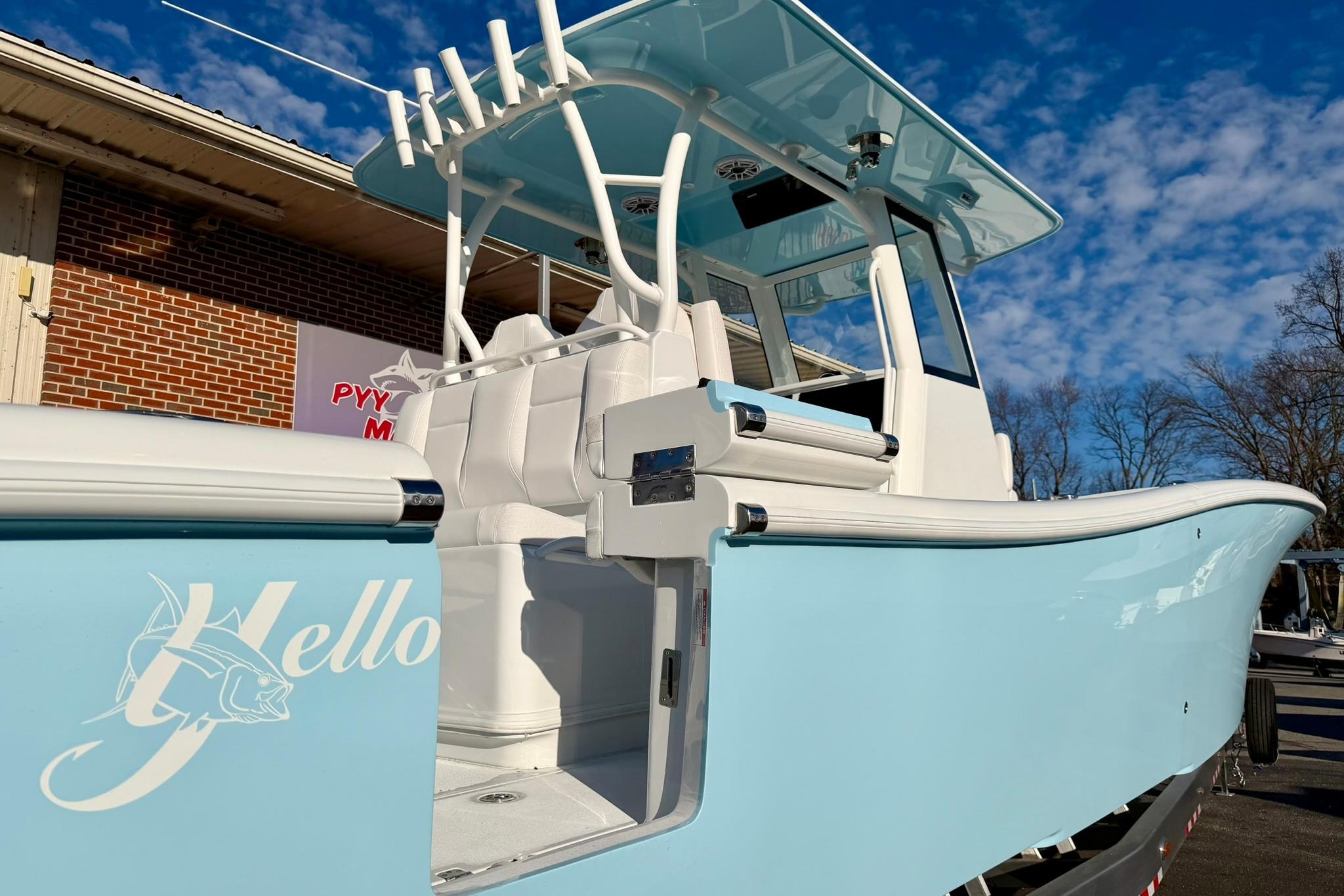 2026 Yellowfin 36 Offshore boat with light blue hull and white interior.