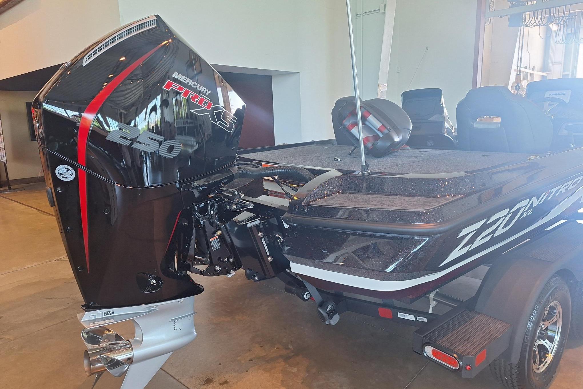 2026 Nitro Z20 XL boat with Mercury Pro XS 250 engine in showroom.
