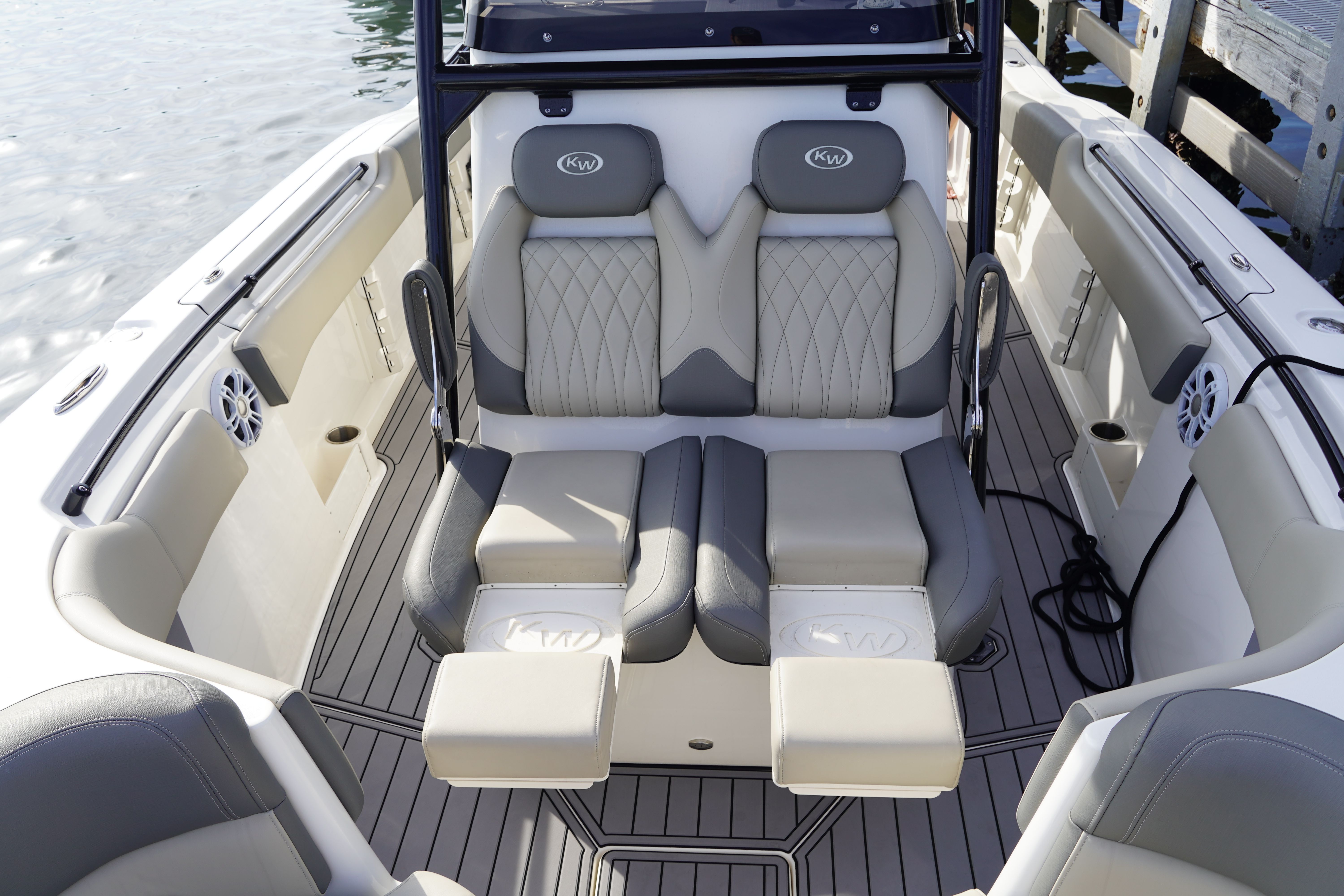 Interior view of a luxury boat with cushioned seats and sleek details.