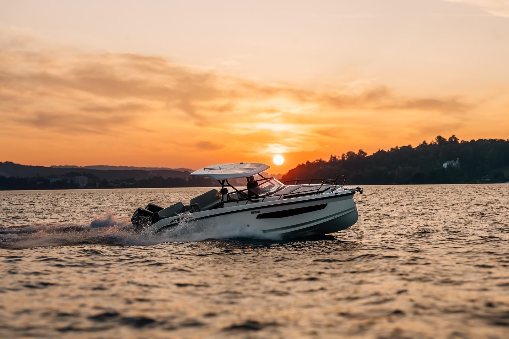 Navan S30 boat 2026 cruising at sunset on the water.