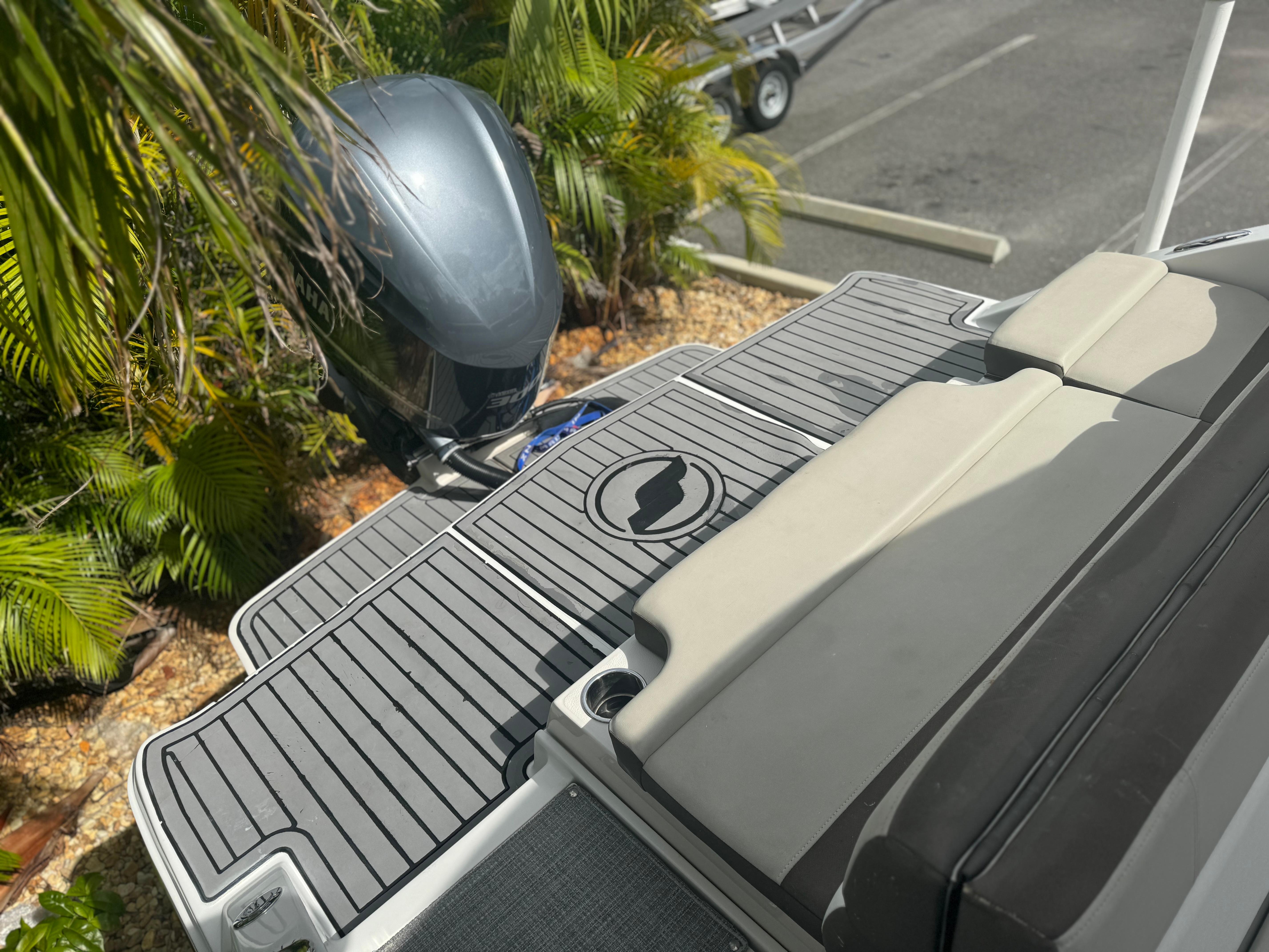 2017 Starcraft 230 OB SCX EXT boat with outboard motor and cushioned seating.