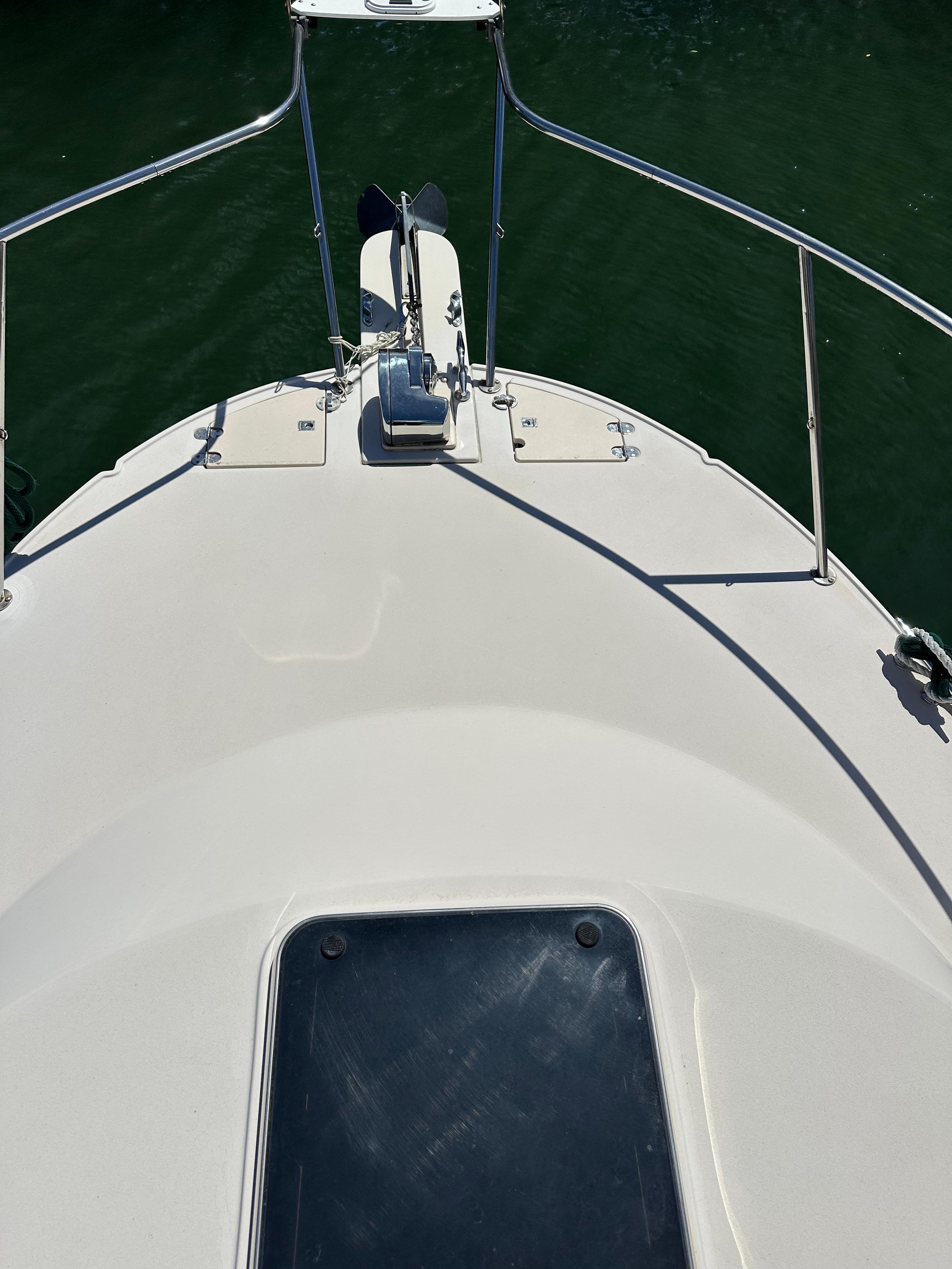 2006 Albin 28 Tournament Express boat deck with anchor, railing, and hatch.