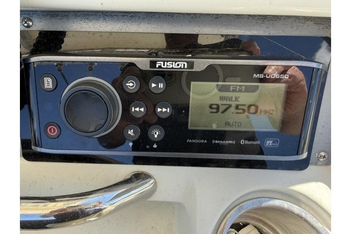 Fusion MS-UD650 radio on 2006 Sailfish 2660 CC, displaying FM 97.5 MHz.