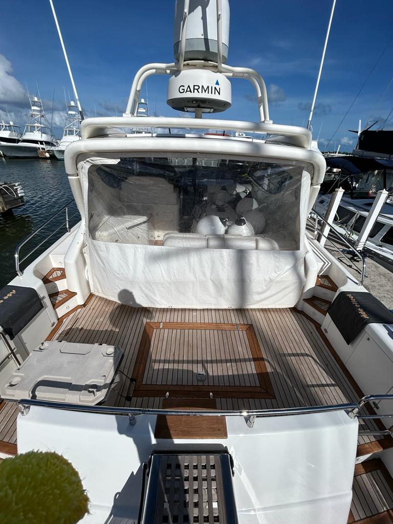 2007 Uniesse 54 Sport yacht with Garmin navigation, docked at a marina.
