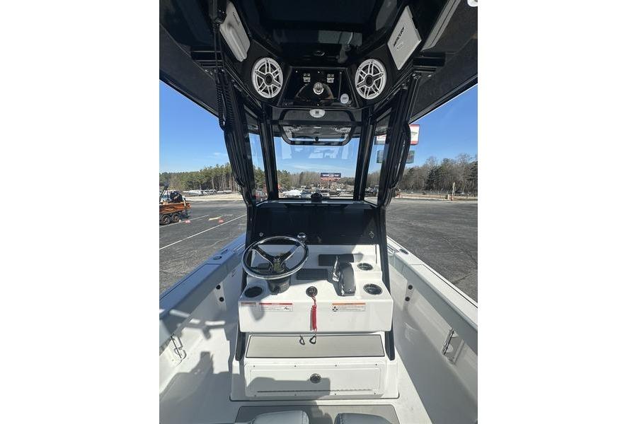 2026 Sportsman Masters 247 Bay Boat cockpit with steering wheel and control panel.