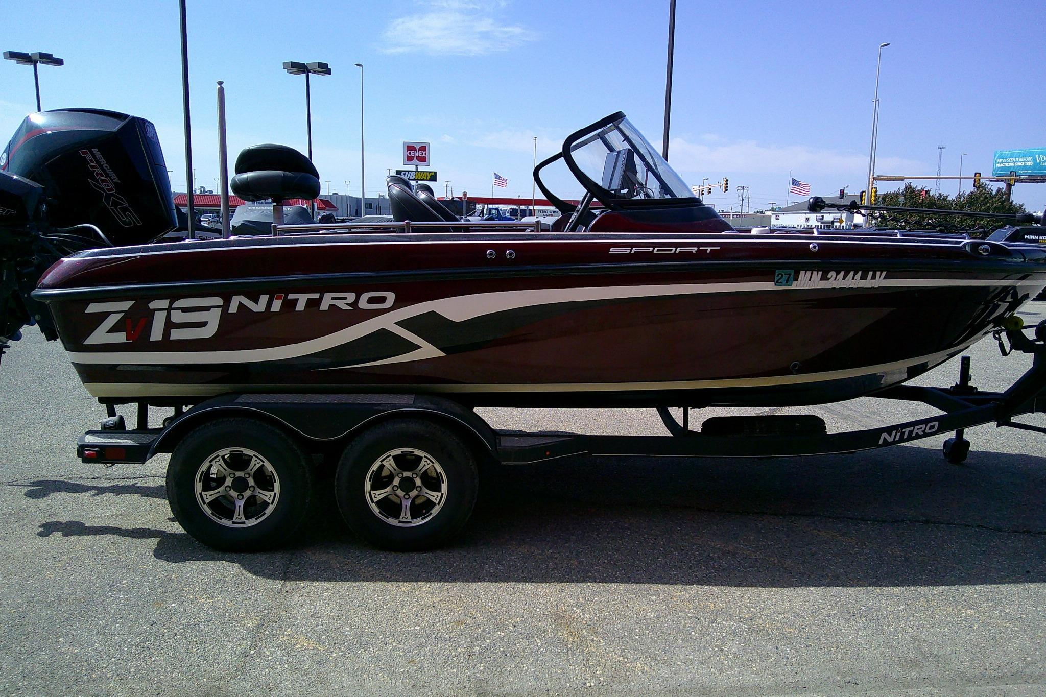 2019 Nitro ZV19 Sport boat on trailer in parking lot.