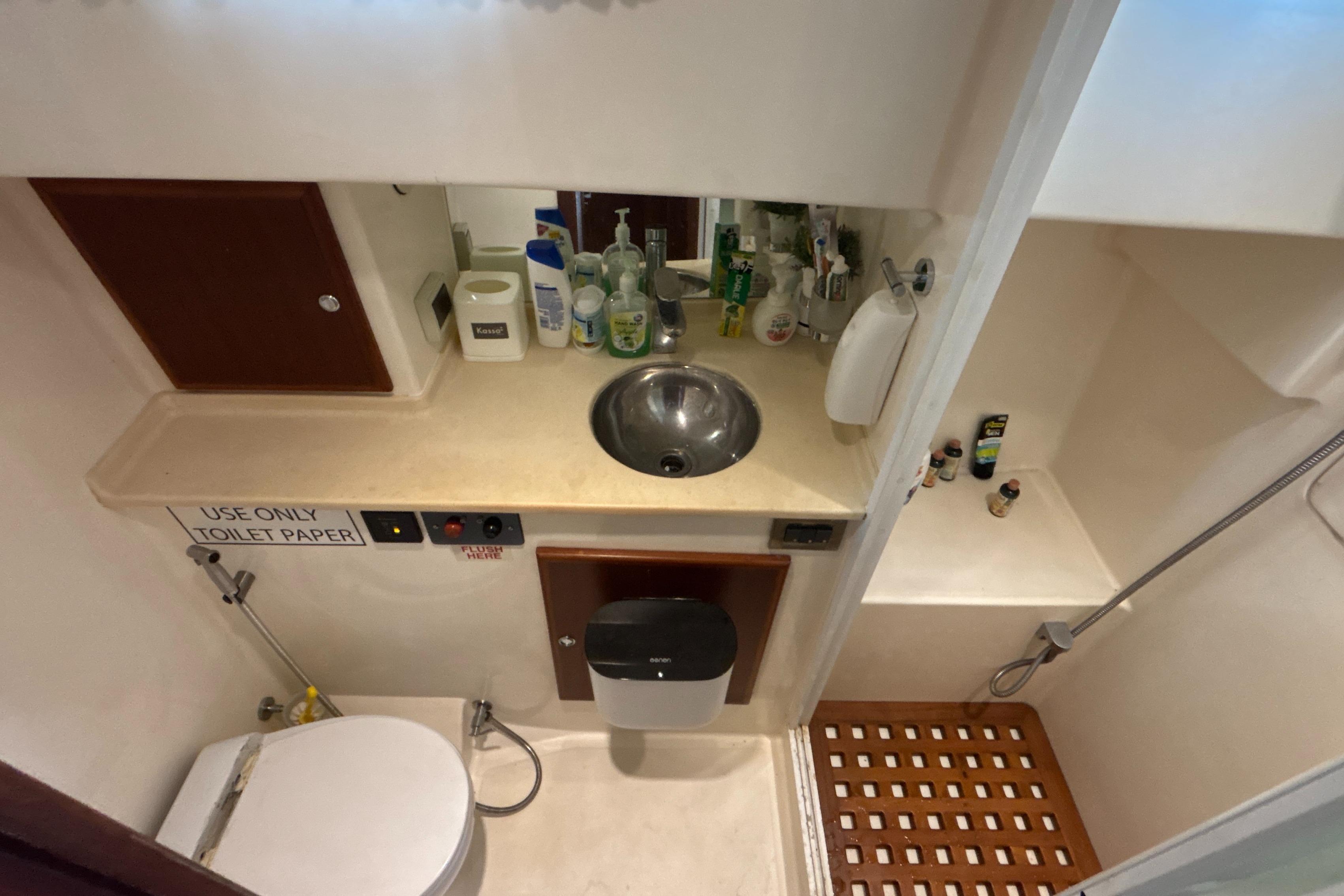 Bathroom interior of 2013 Explorer Motor Yachts 43 Sedan with sink and shower.