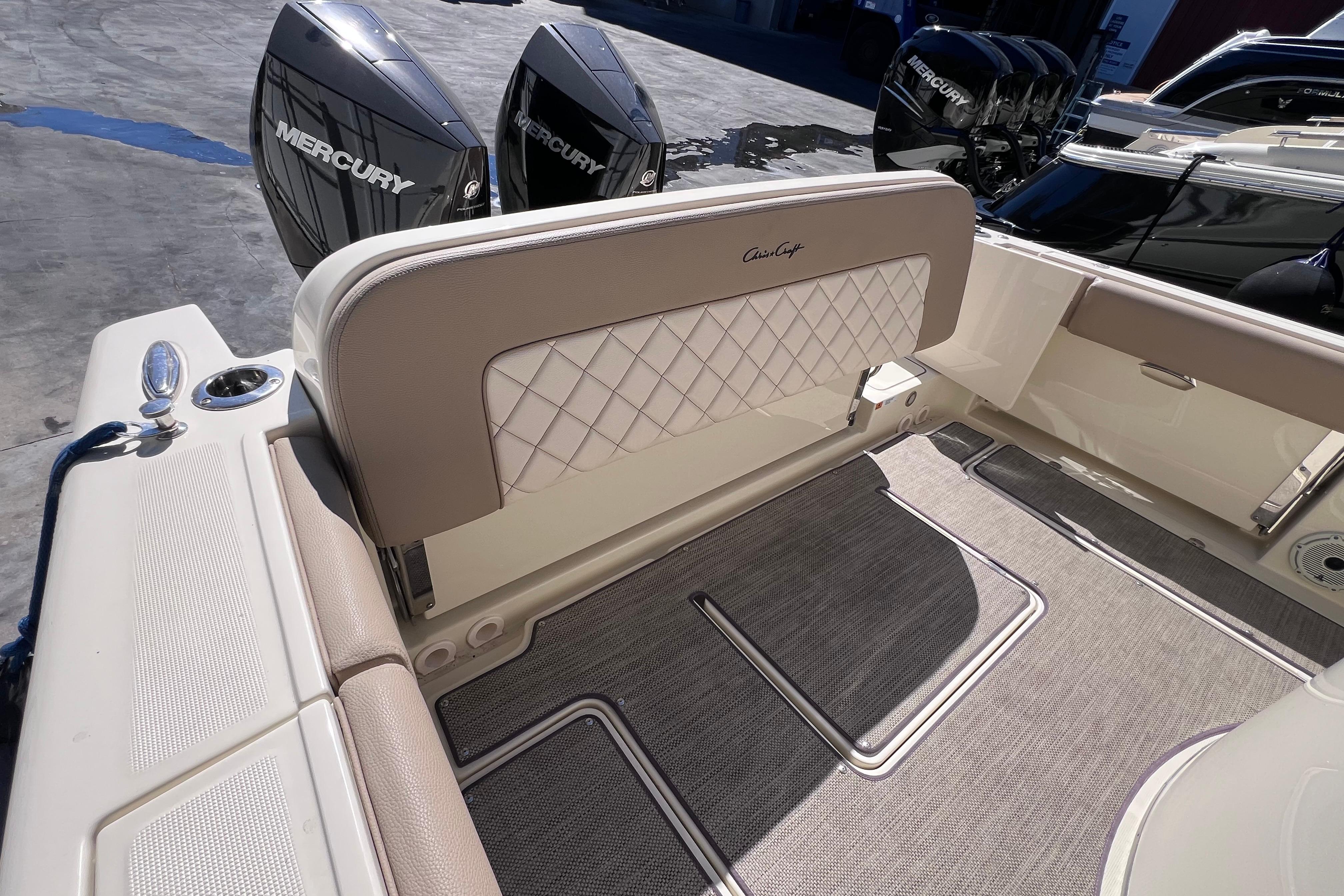 2022 Chris-Craft Catalina 30 boat interior with Mercury engines, featuring elegant seating and flooring.