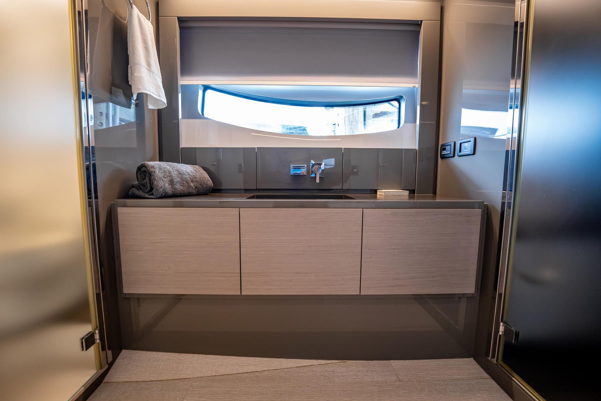 Luxurious bathroom on a 2020 Pershing 62 yacht.