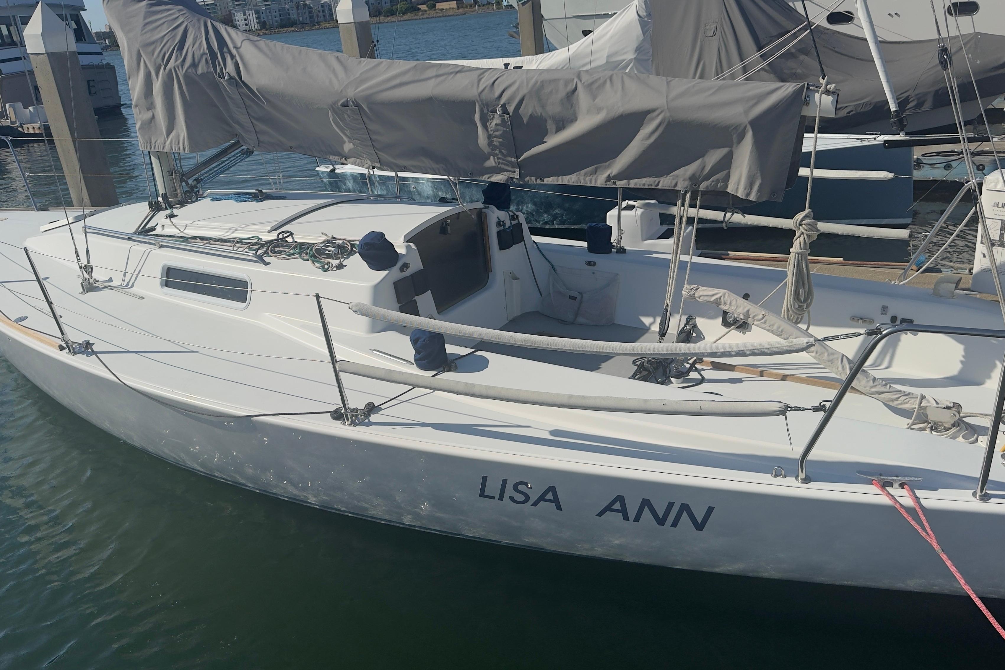 1994 J Boats J/92 sailboat named "Lisa Ann" docked at a marina.