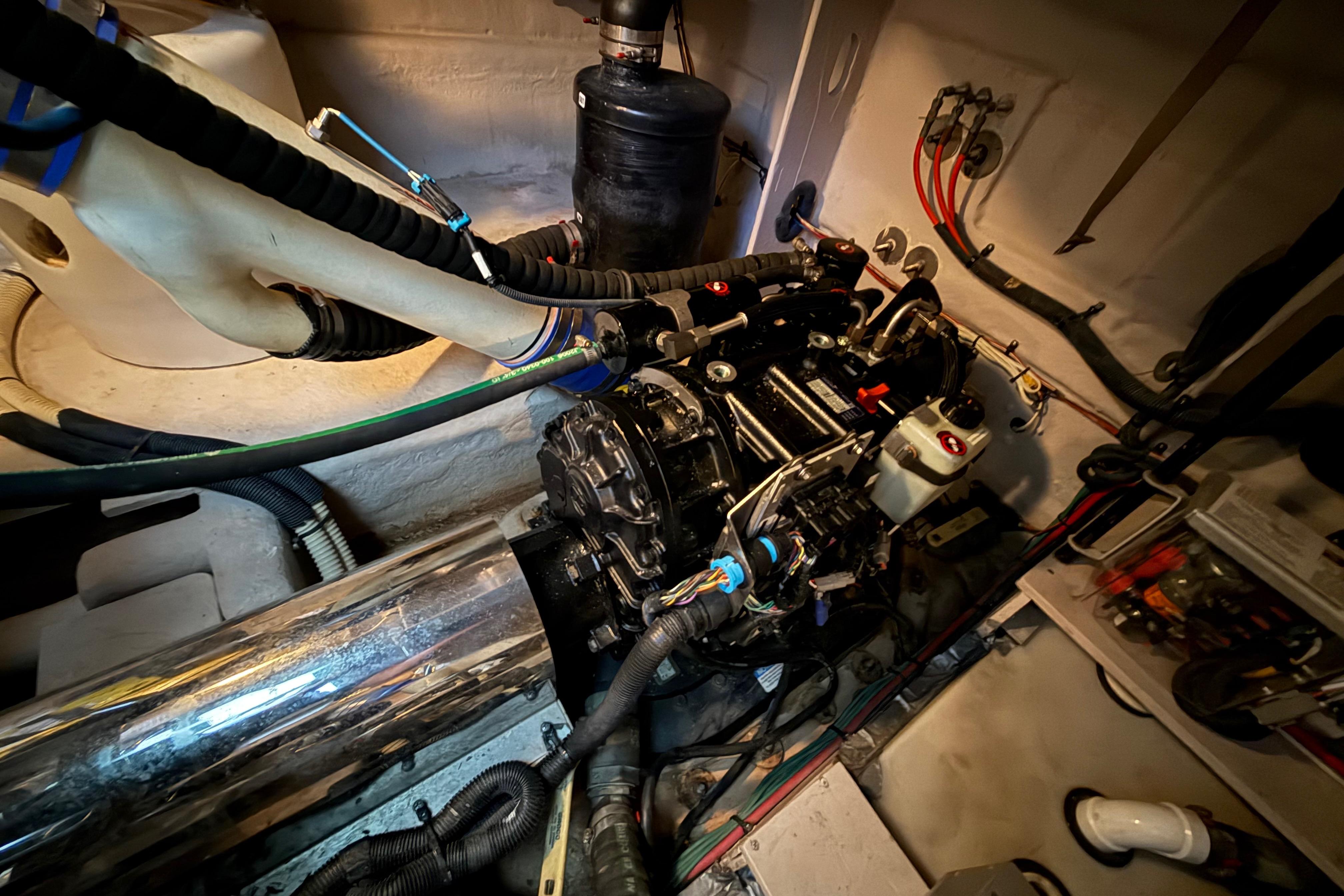 Engine room of 2016 Sea Ray Sundancer 510 yacht, showcasing mechanical components and wiring.