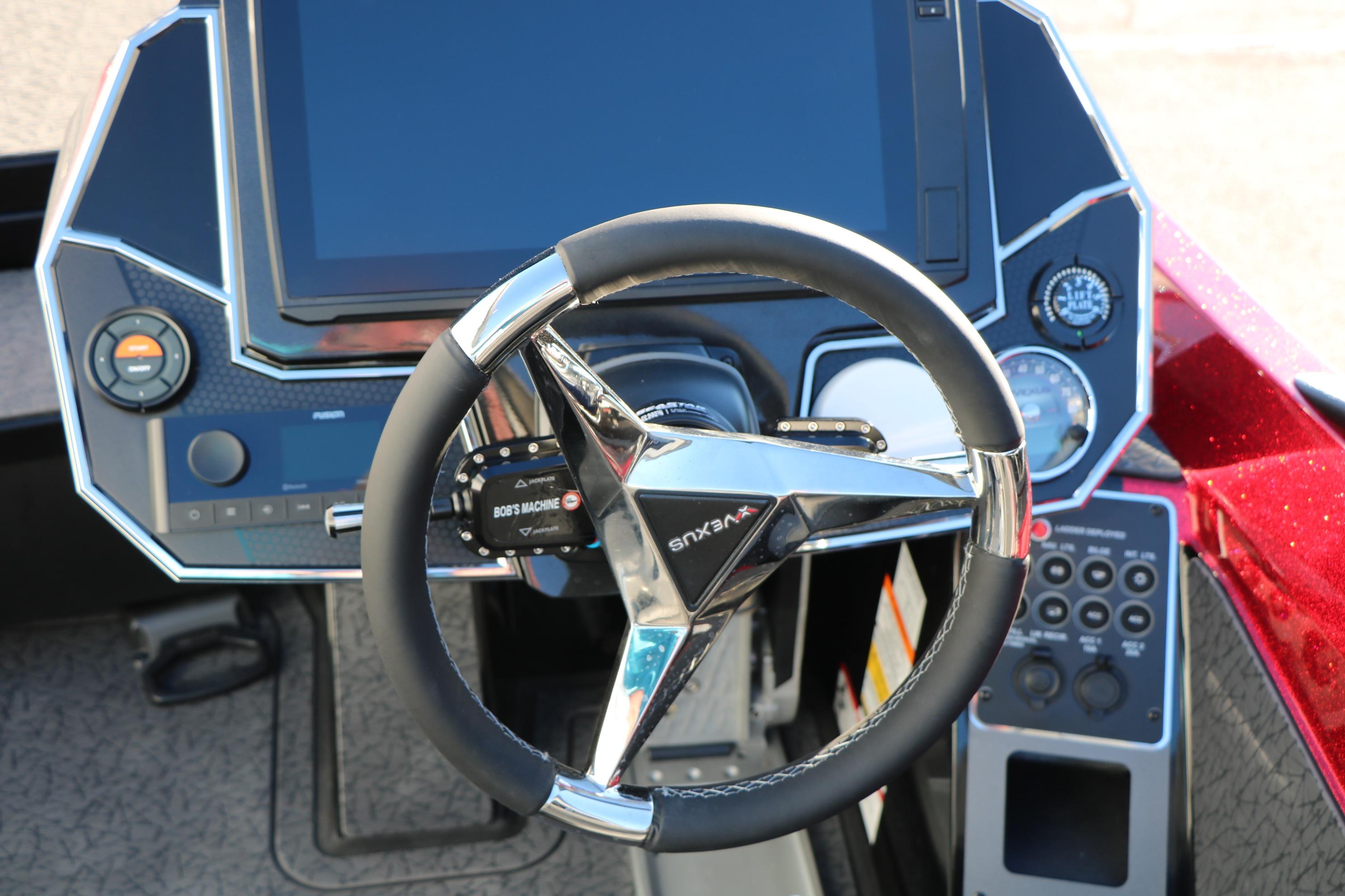 2026 Vexus VXs21 boat dashboard with steering wheel and control panel.