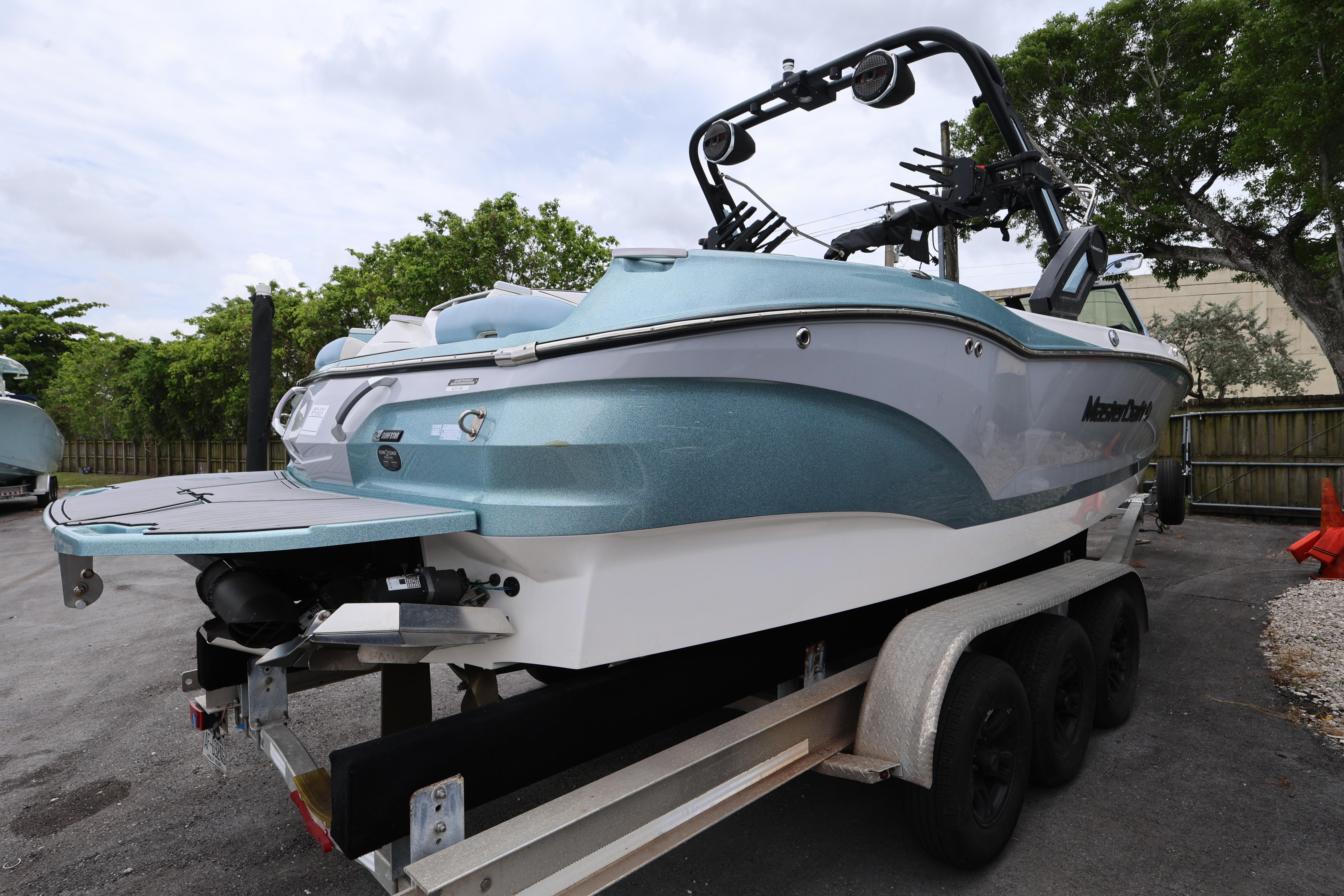 2023 MasterCraft X24 boat on trailer, showcasing sleek design and modern features.