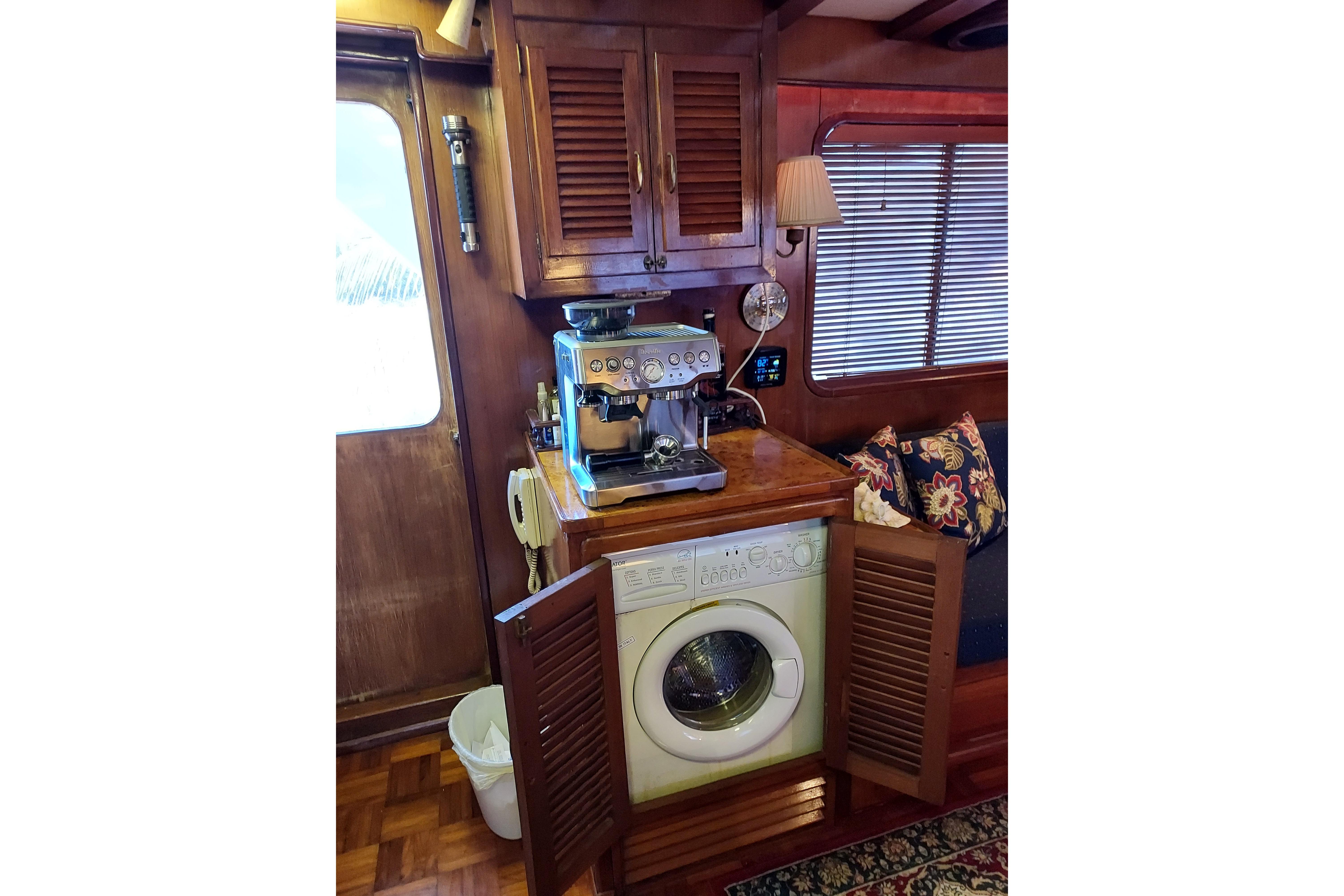 Interior of 1982 DeFever 52 Offshore Cruiser with coffee machine and washing machine.