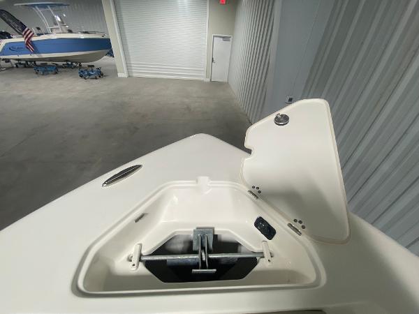 2024 Key West 219 FS boat anchor compartment in a storage facility.