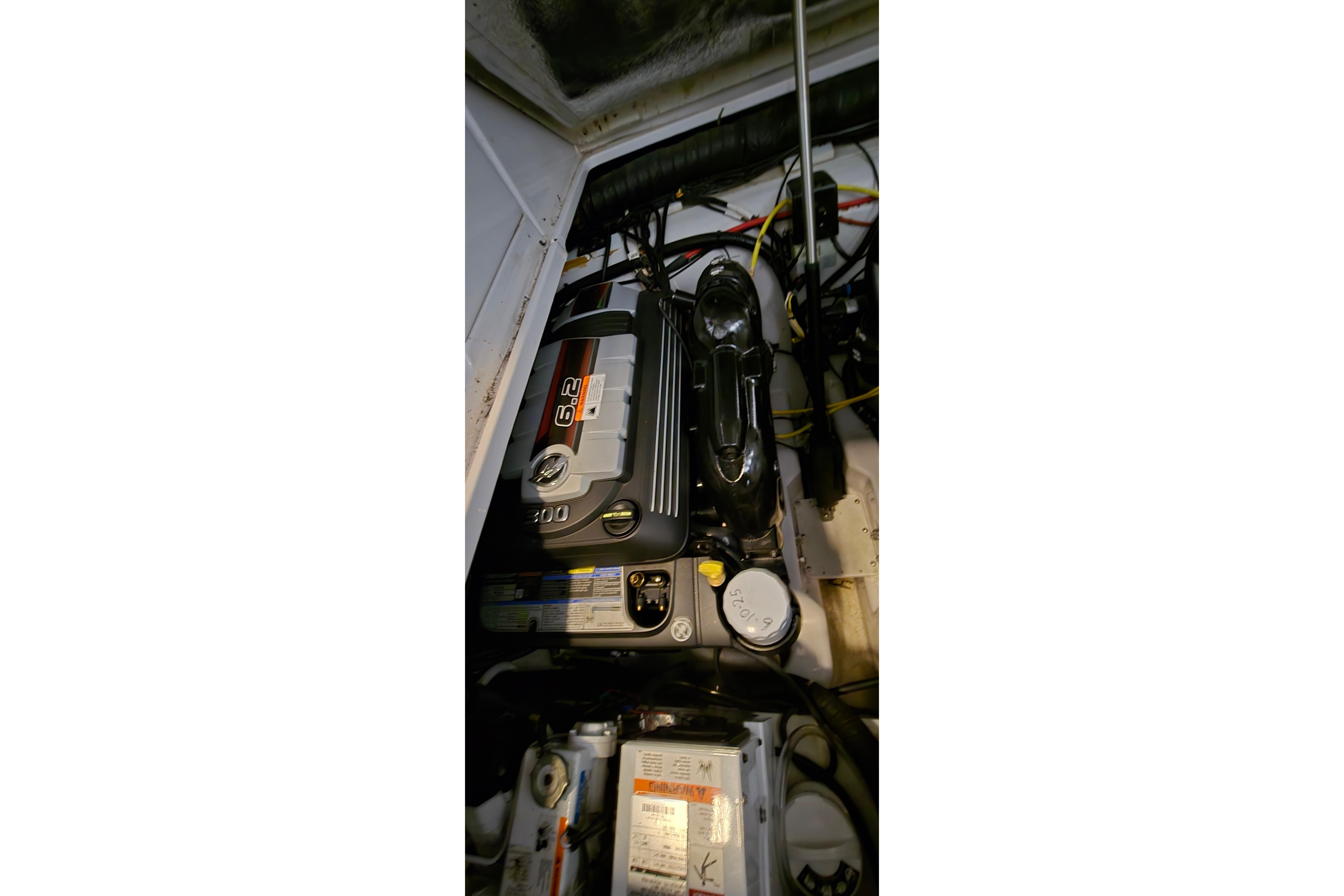 Engine compartment of a 2018 Four Winns V355 boat, featuring a 6.2-liter engine.