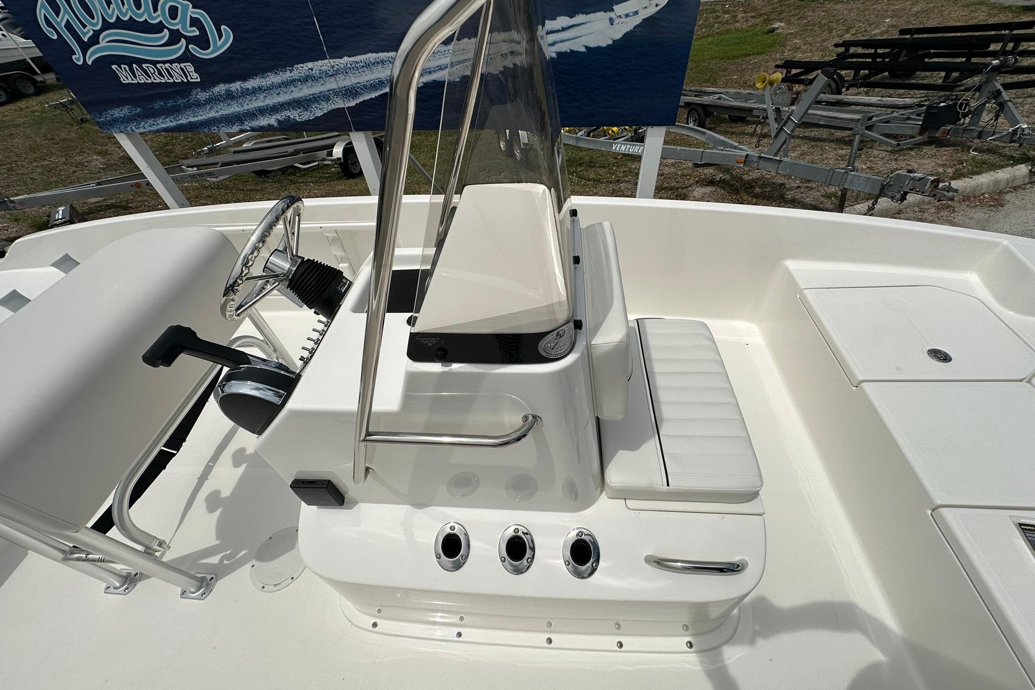 2026 Bayliner Trophy T18 boat interior with steering console and seating.