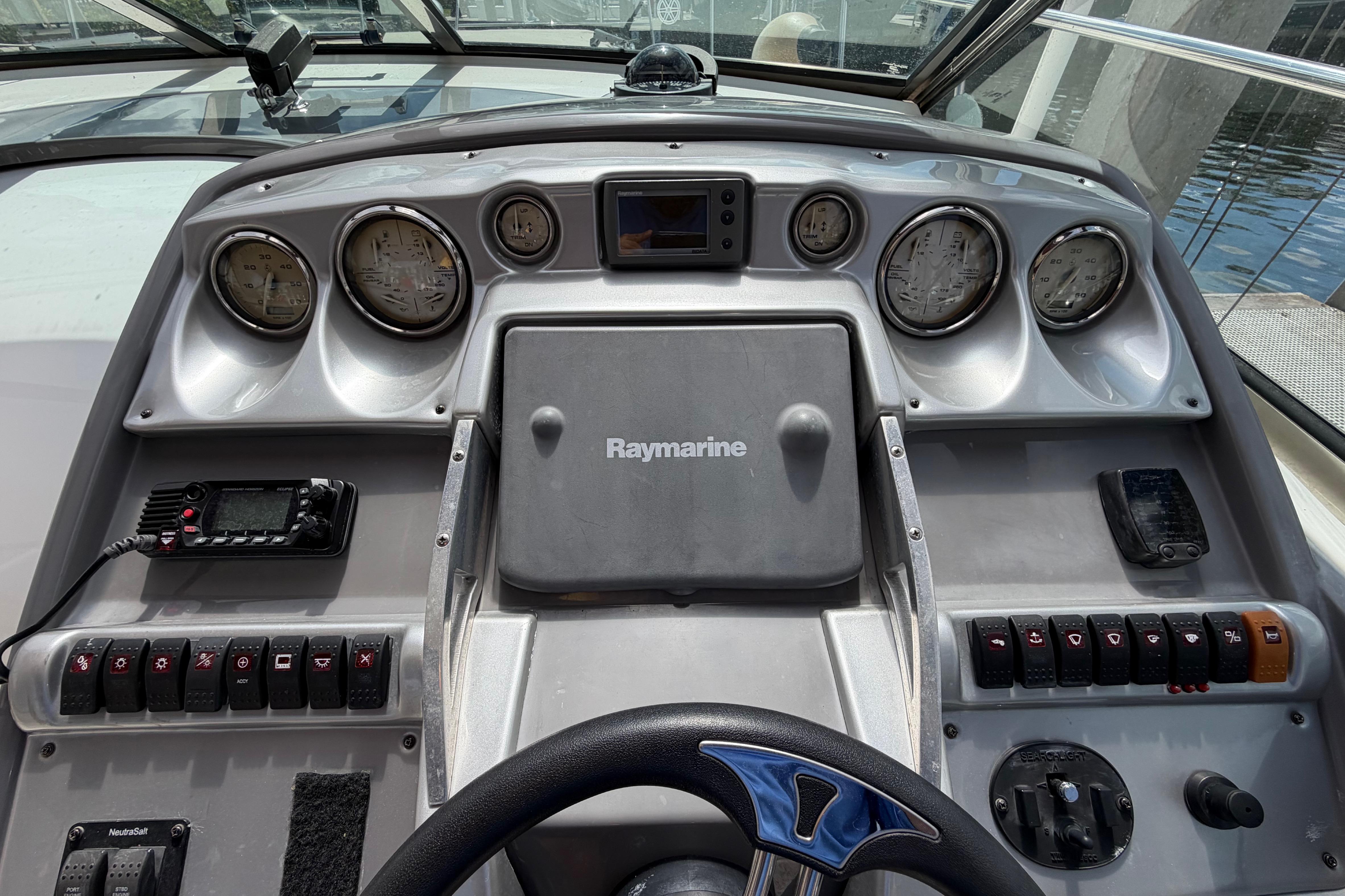Cockpit dashboard of a 2007 Monterey 350 Sport Yacht with gauges and controls.