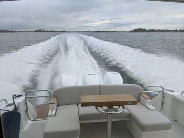 Back Cove 39O 2025 model cruising on open water, view from the rear seating area.