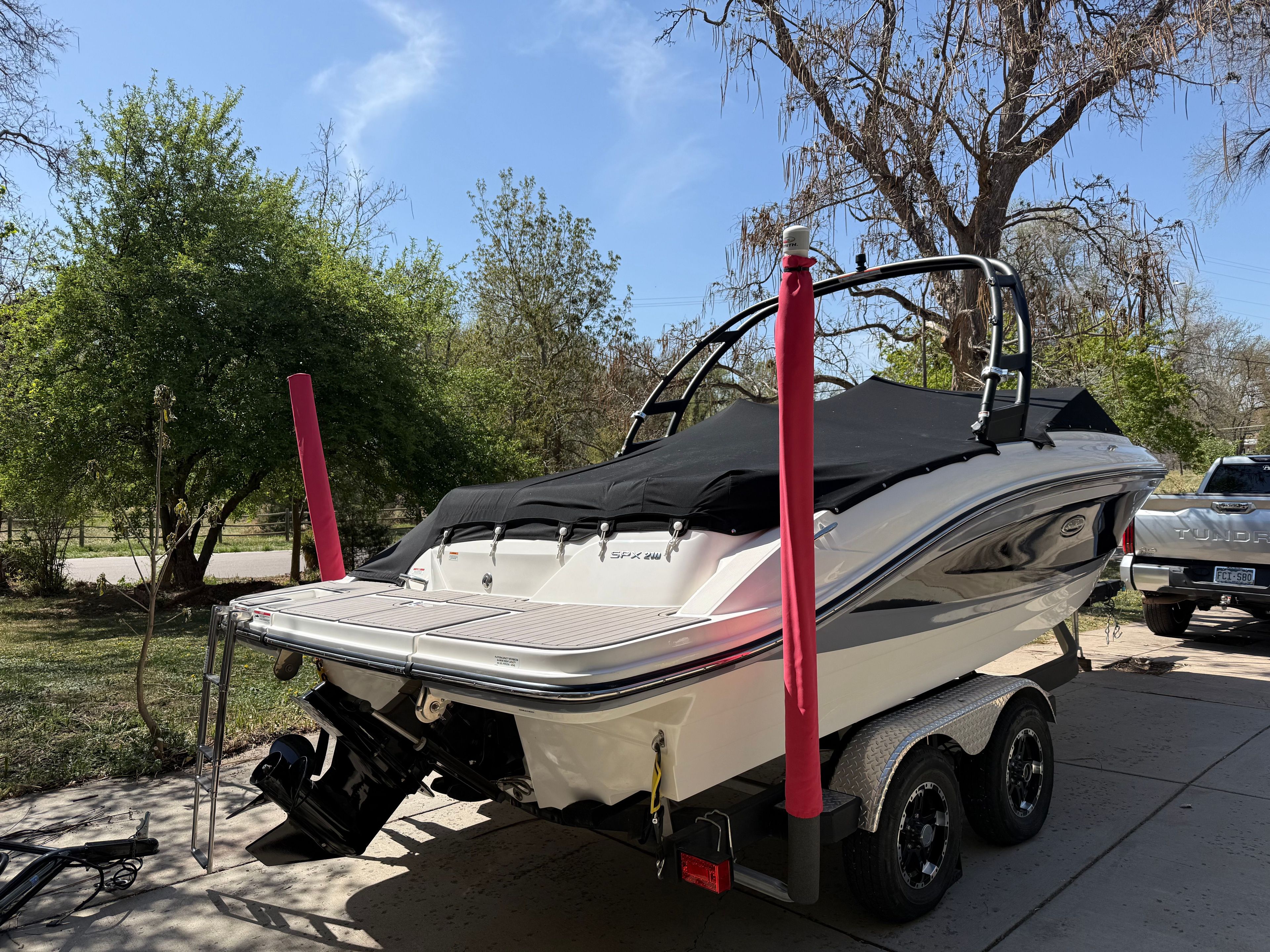 2022 Sea Ray SPX 210 boat parked on trailer outdoors.