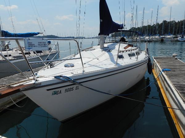 1984 Catalina 30 sailboat docked at a marina.