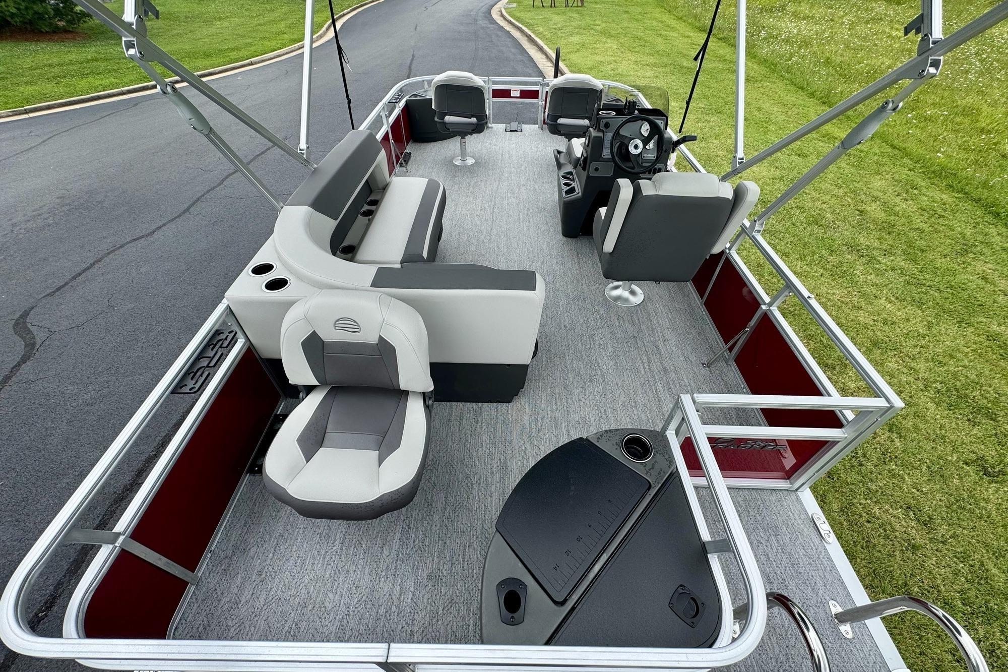 2026 Sun Tracker Bass Buggy 18 DLX pontoon boat with spacious seating and modern design.