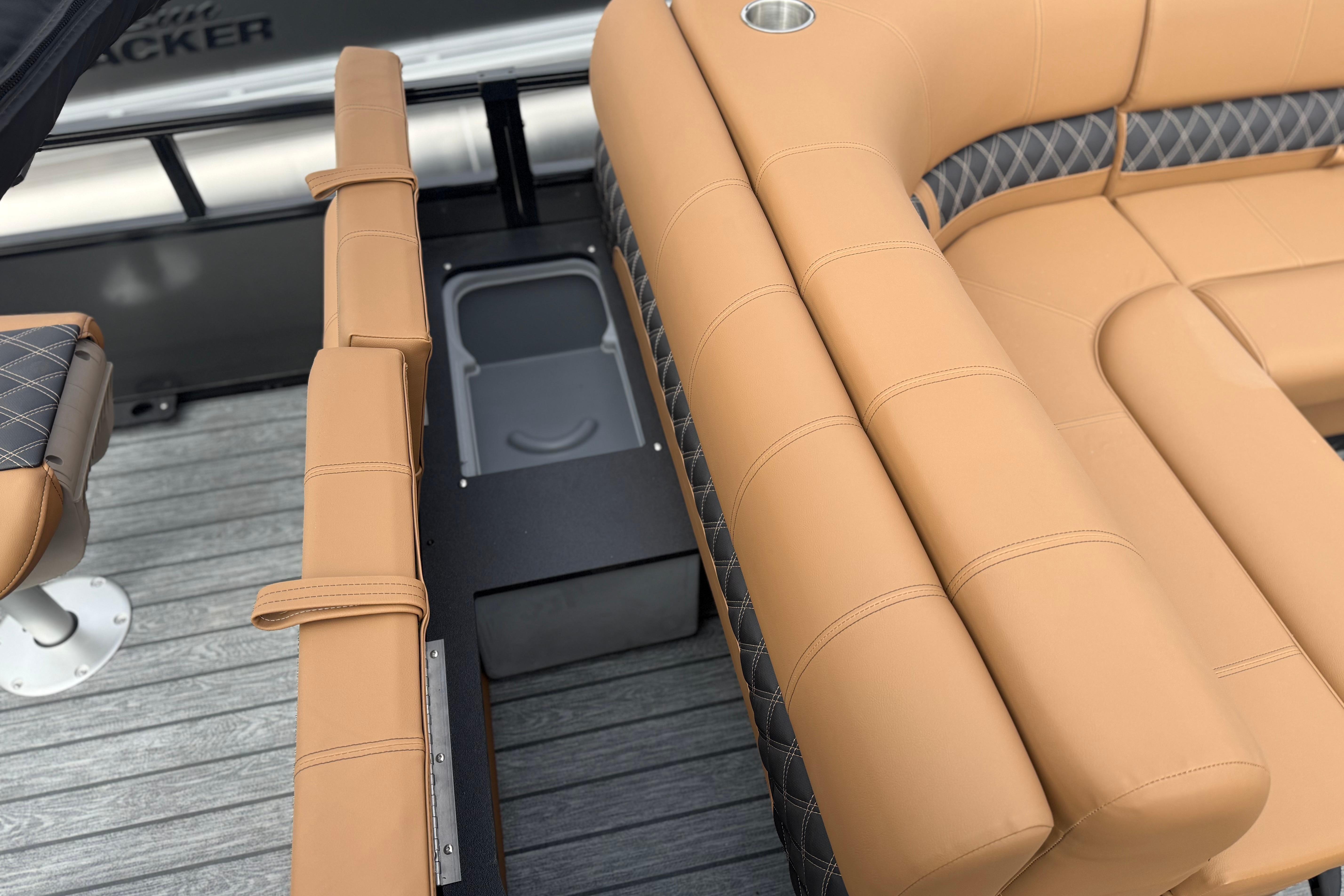 Luxurious tan seating on 2026 Ranger 220F boat, featuring diamond-patterned accents and cup holder.