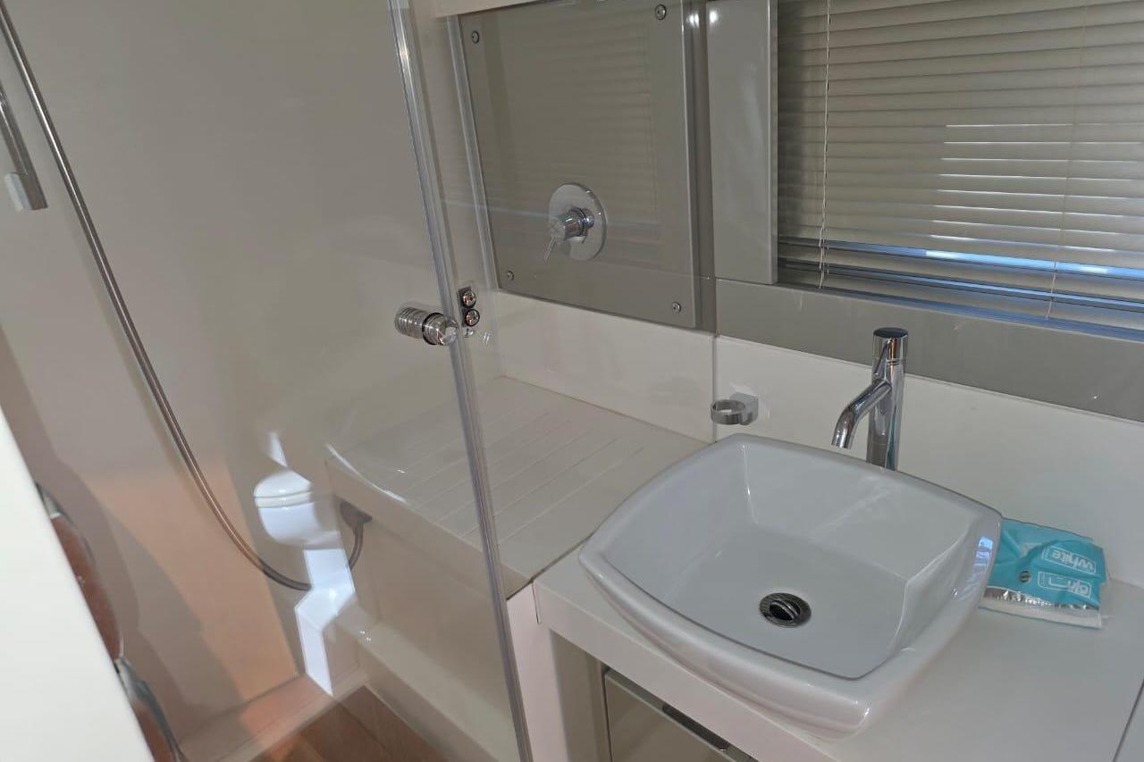 Bathroom interior of 2013 Fairline Targa 62 GT yacht, featuring modern sink and shower.