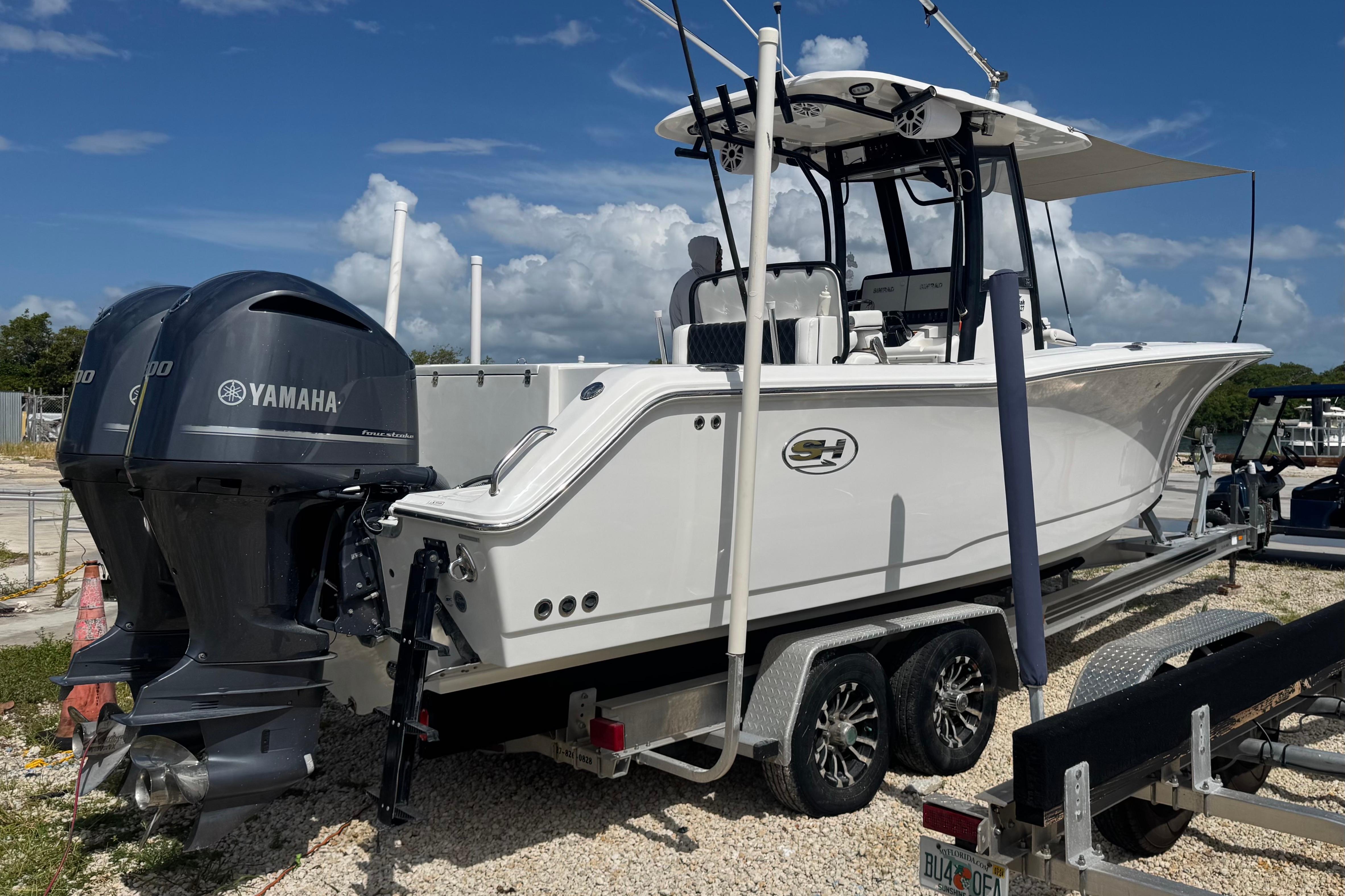2019 Sea Hunt Gamefish 27 Coffin Box boat with Yamaha engines on a trailer.