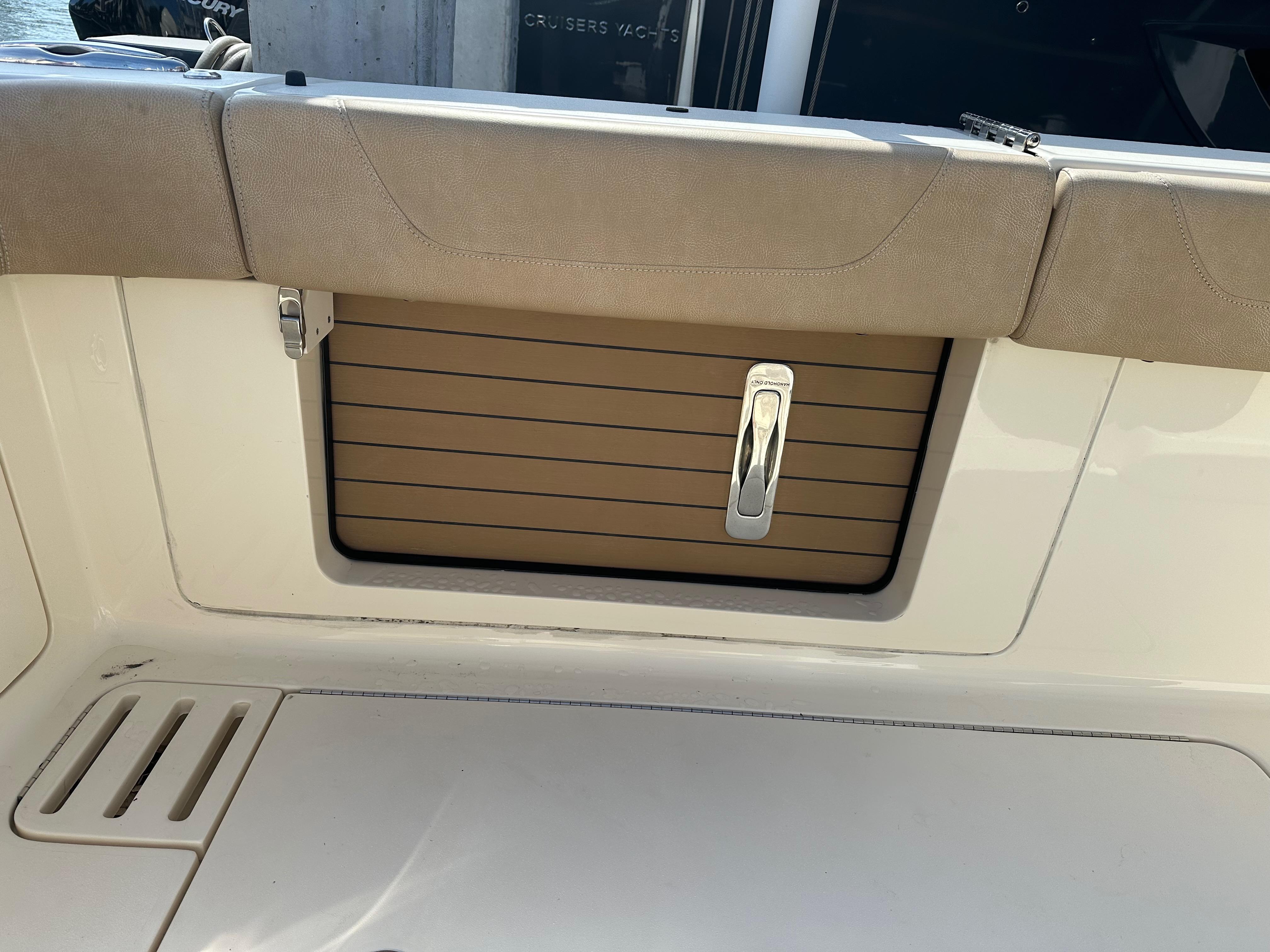 2019 Scout 380 LXF boat interior with cushioned seating and storage compartment.