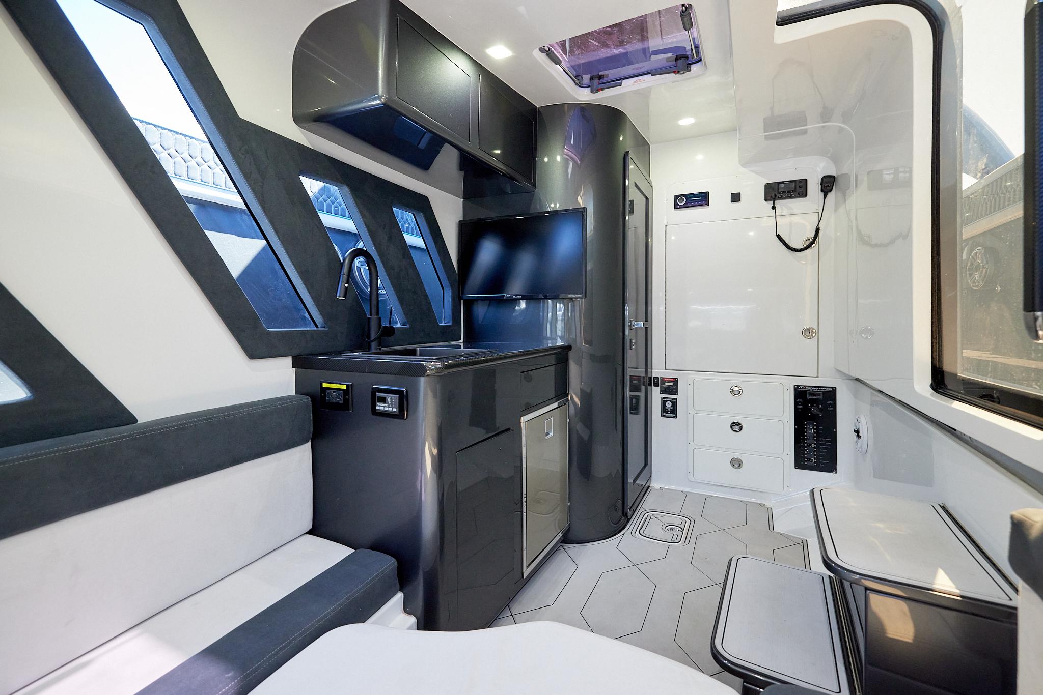 Luxurious interior of 2023 Midnight Express 43' Solstice boat with modern amenities and sleek design.