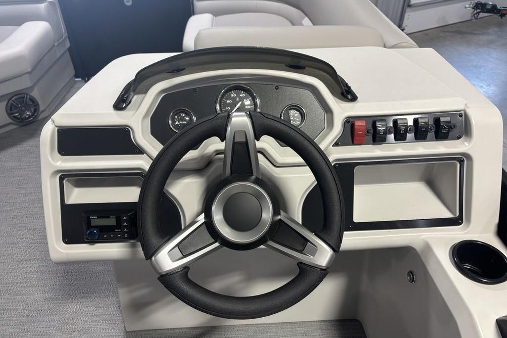 Steering console of 2026 Godfrey Xperience 2086 SFLX boat, featuring modern controls and gauges.
