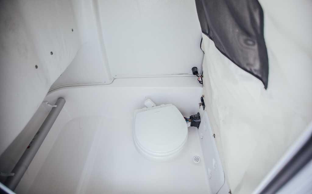 2021 Sea Fox 248 Commander boat interior with compact marine toilet.