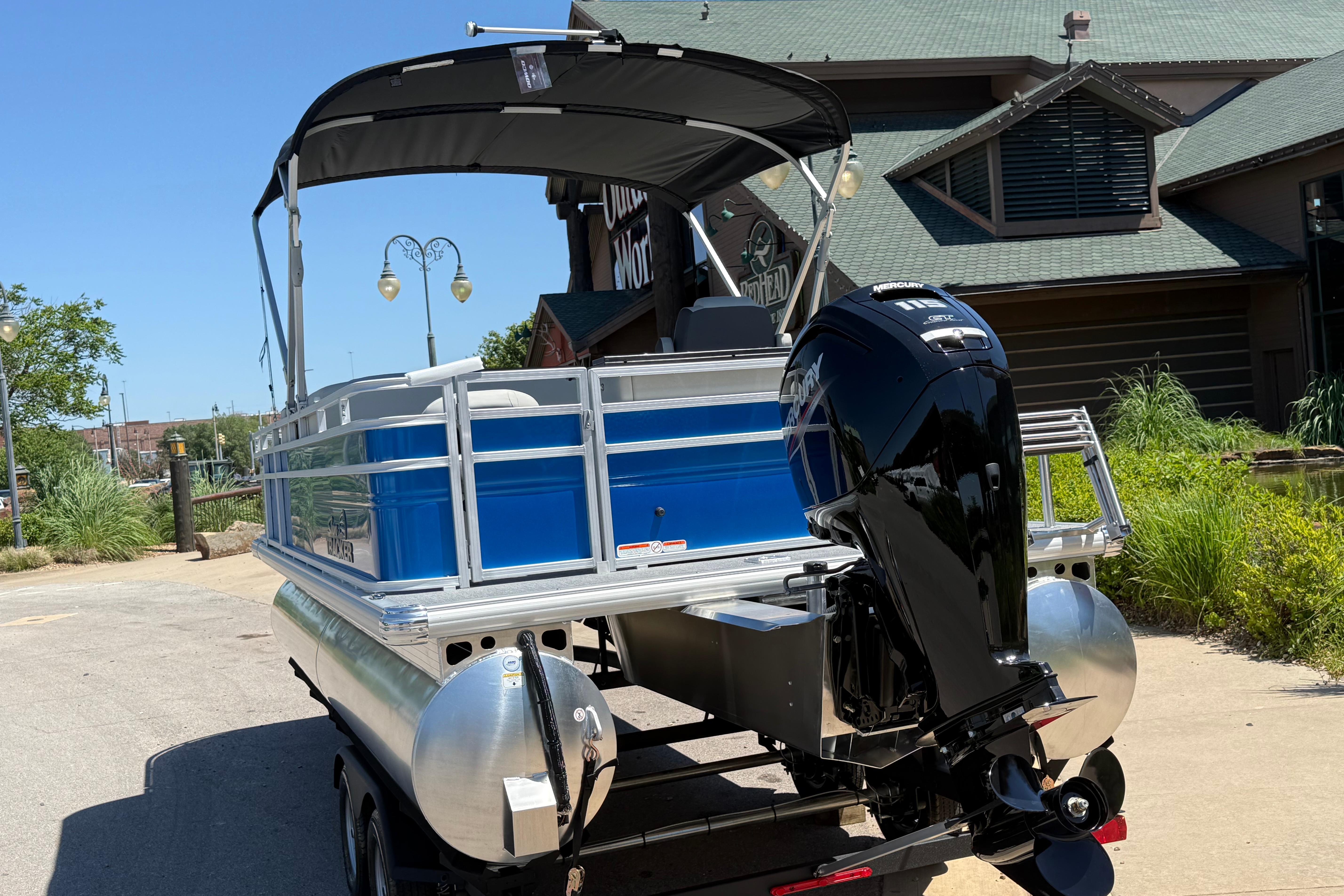2026 Sun Tracker Fishin' Barge 20 DLX pontoon boat with Mercury outboard motor.