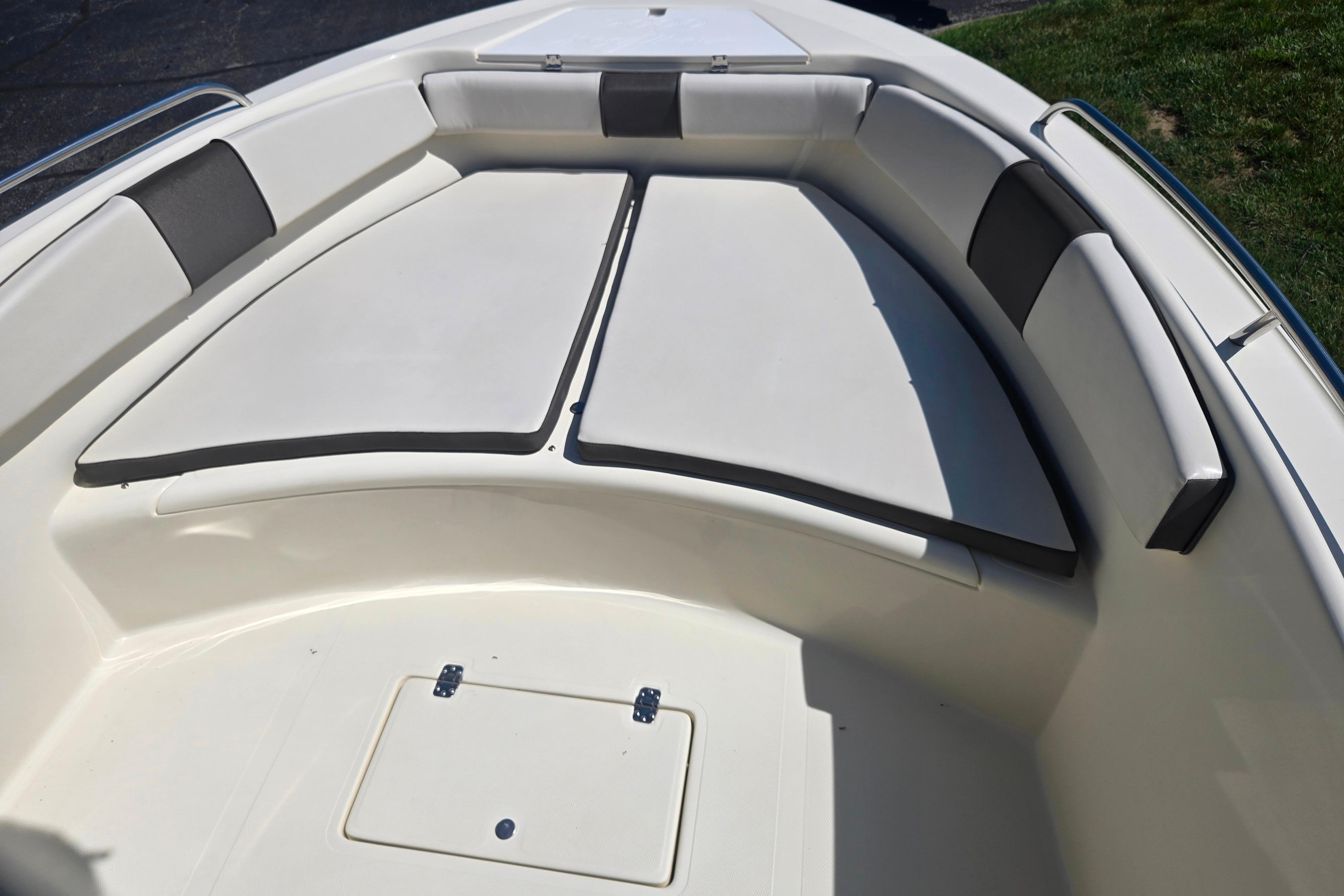 Bow seating area of a 2016 Key Largo 2000CC boat with cushioned seats.