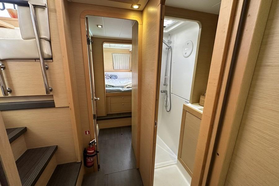 Interior of 2013 Lagoon 39 yacht showing cabin, stairs, and bathroom.