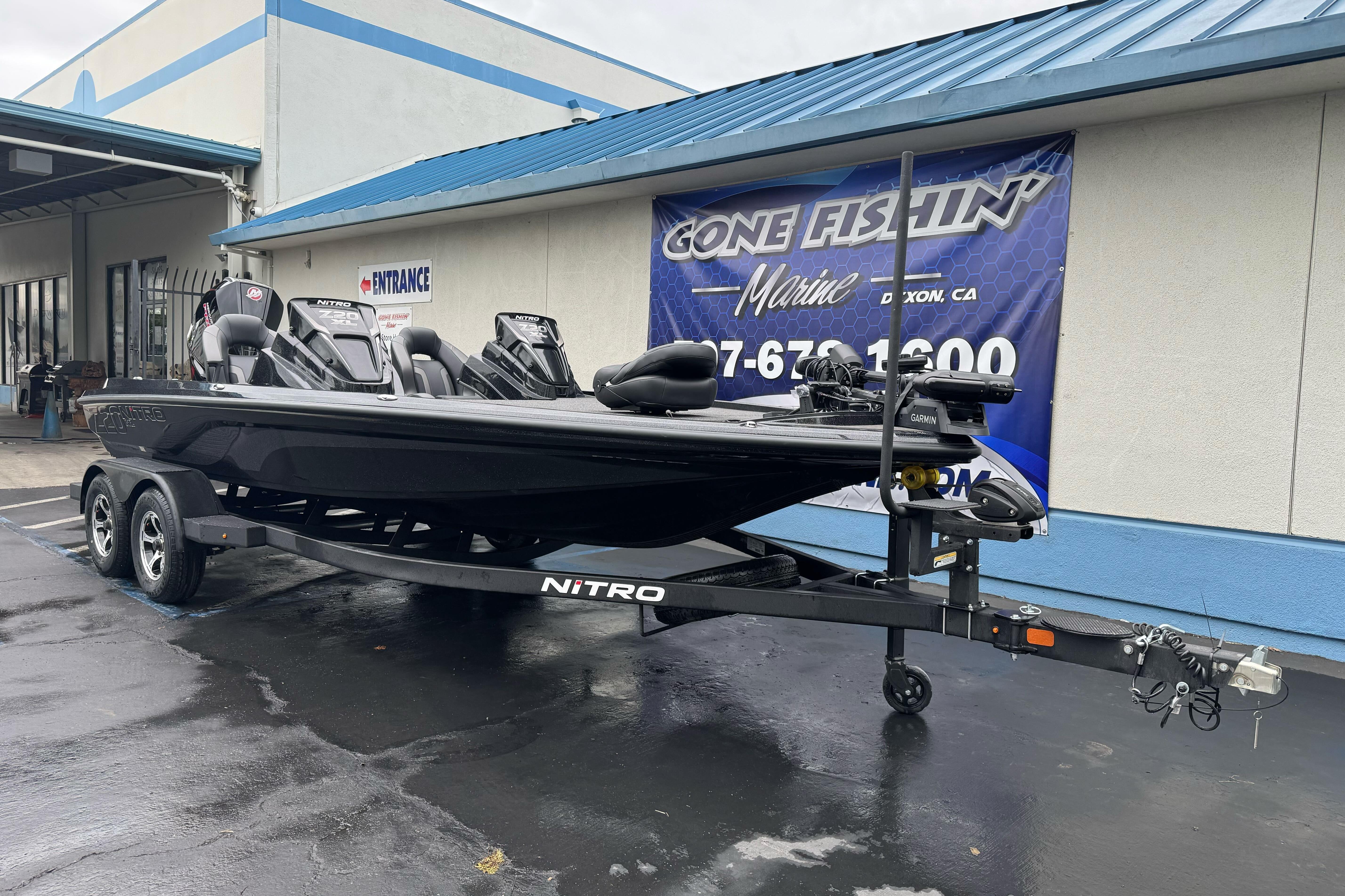 2026 Nitro Z20 XL Pro boat on trailer at dealership entrance.