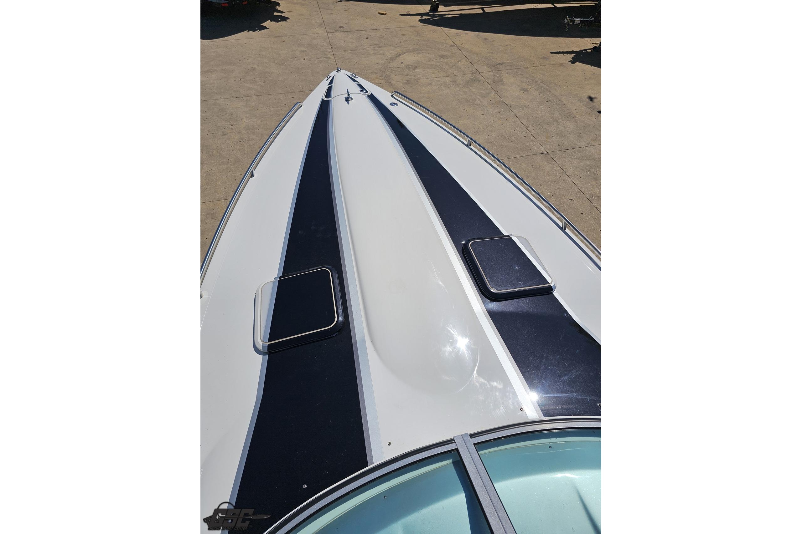 2014 Formula 292 FASTech boat deck with sleek design and dual hatches.