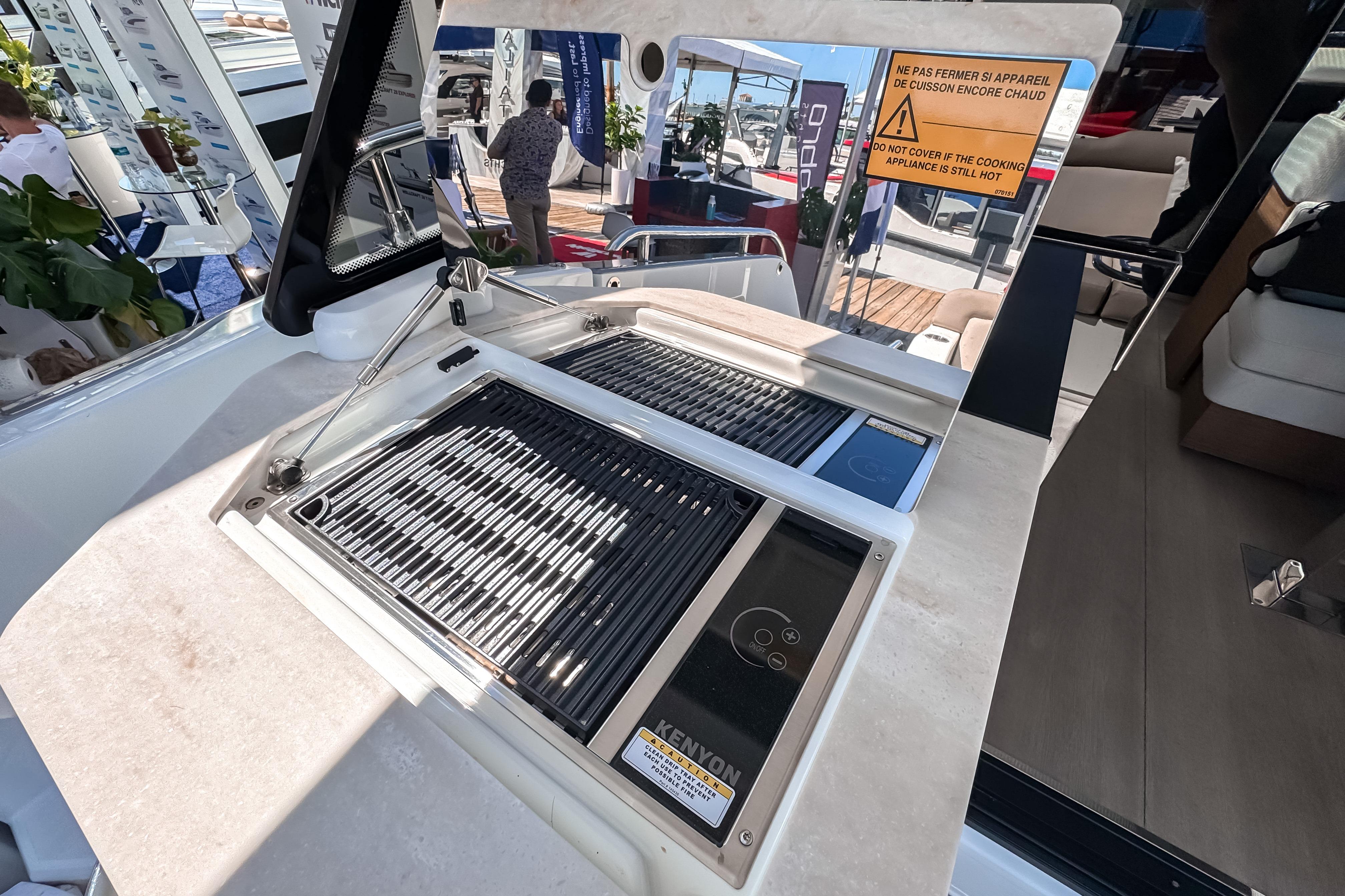 Wellcraft 44 Explorer 2026 with built-in grill on deck.