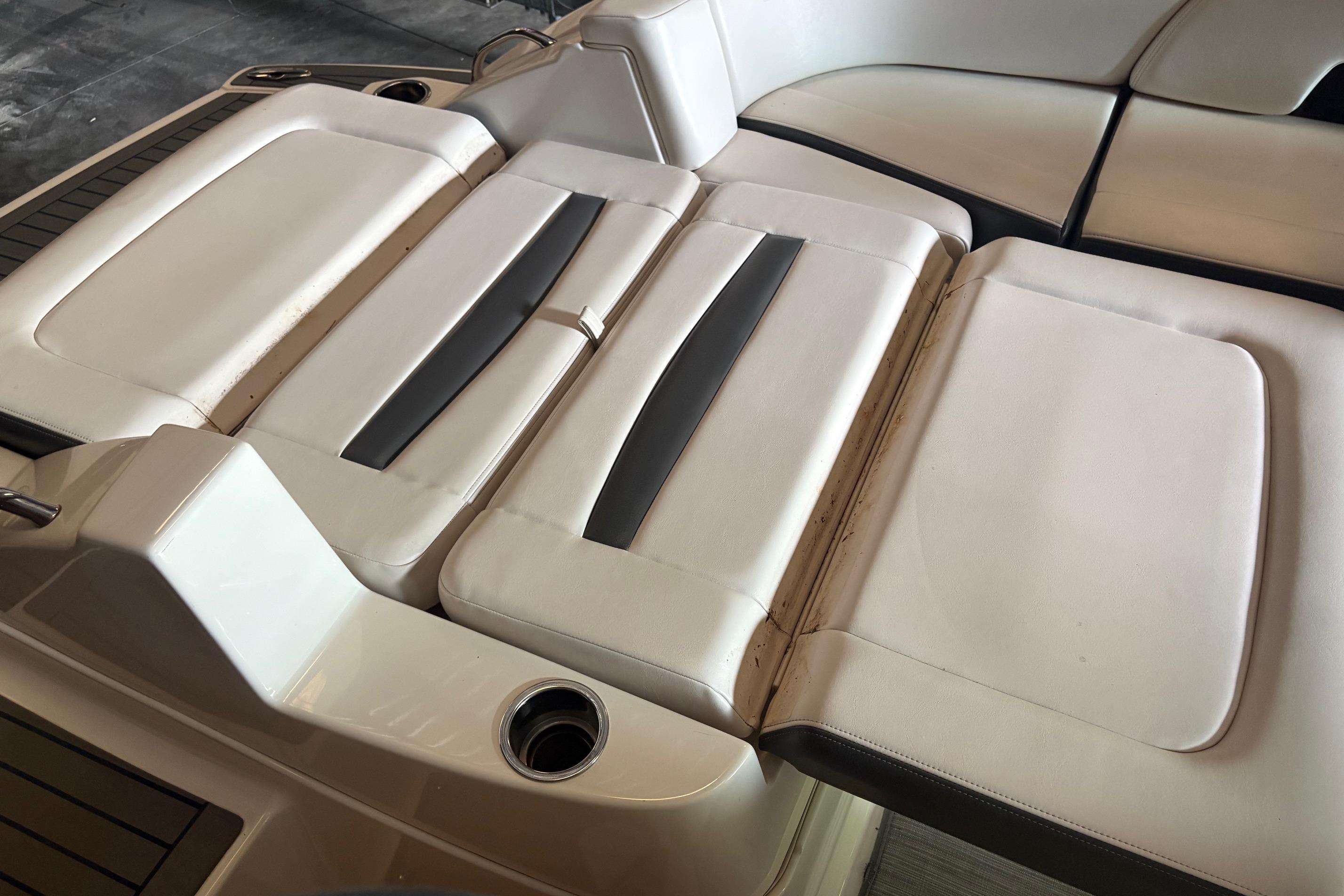 2016 Chaparral 244 Sunesta boat interior seating, featuring white and gray upholstery.