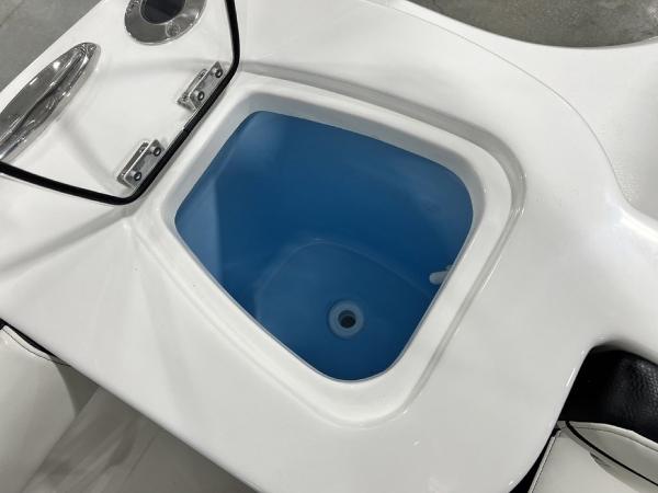Tidewater 232 CC Adventure 2023 boat, blue storage compartment.