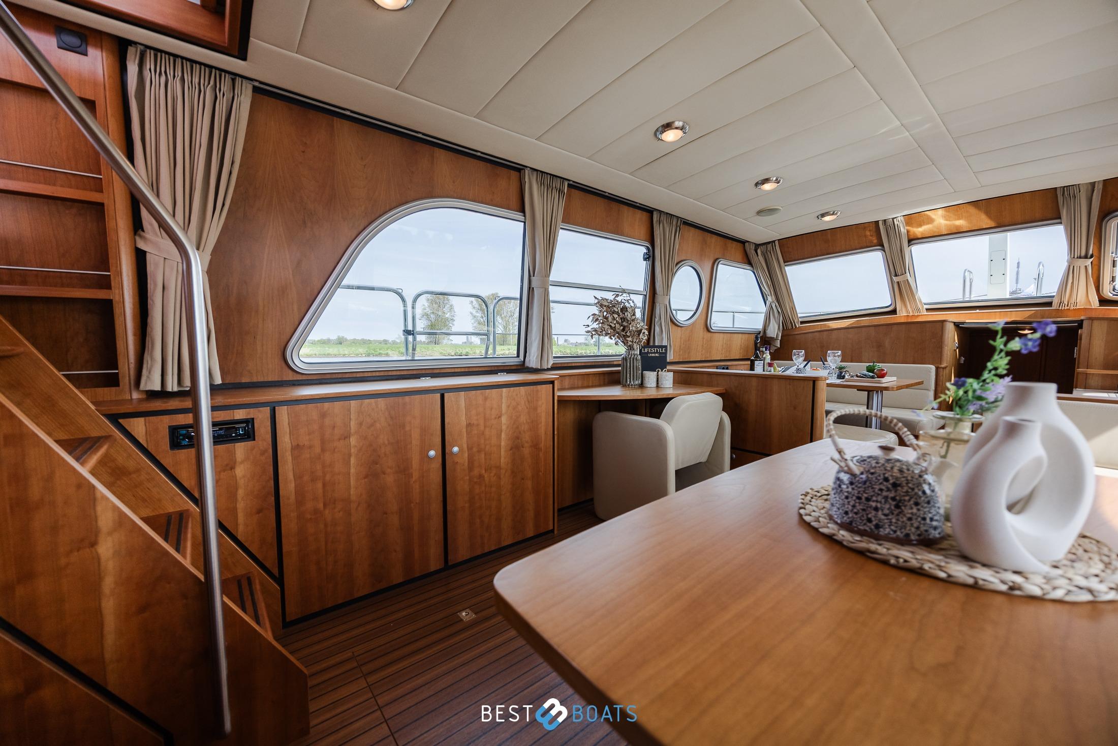 Luxurious interior of 2010 Linssen Grand Sturdy 43.9 AC yacht with elegant wood finish.