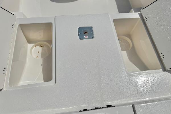 2025 Carolina Skiff 21 LS boat deck with storage compartments.