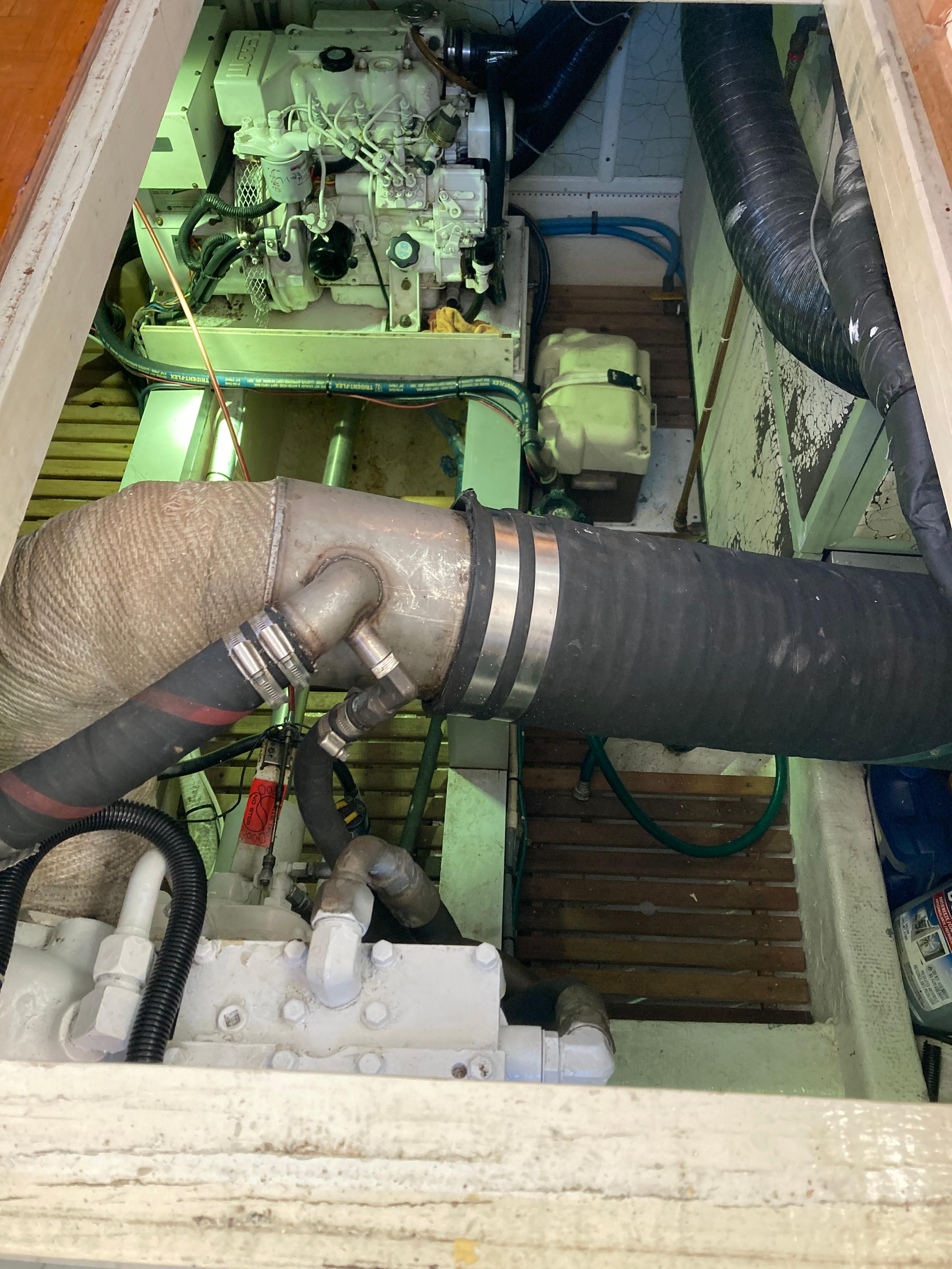 Engine room of 1985 Grand Banks 42 Classic with visible machinery and piping.