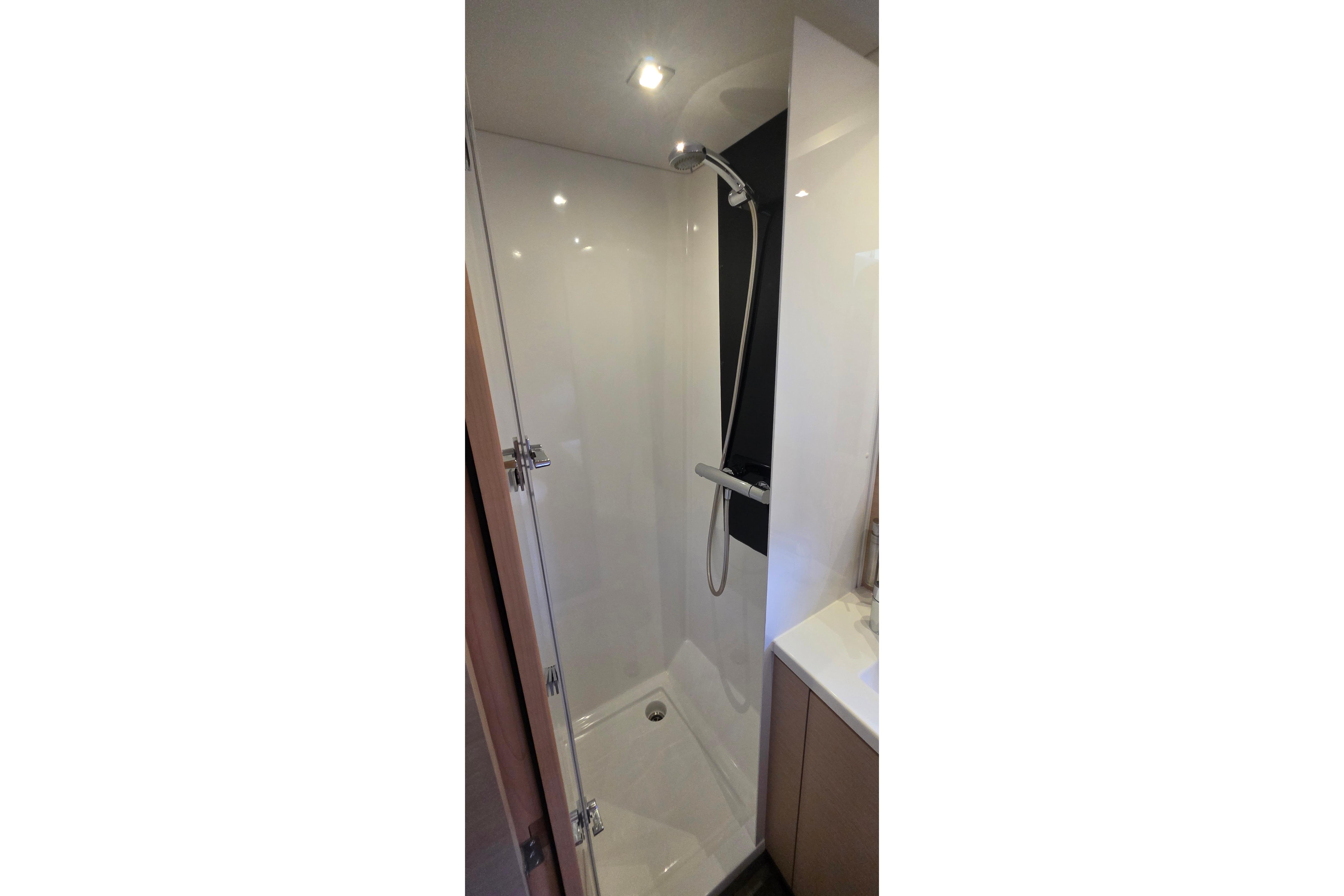 Shower area in 2018 Fountaine Pajot Motor Yacht 44, featuring modern fixtures and sleek design.