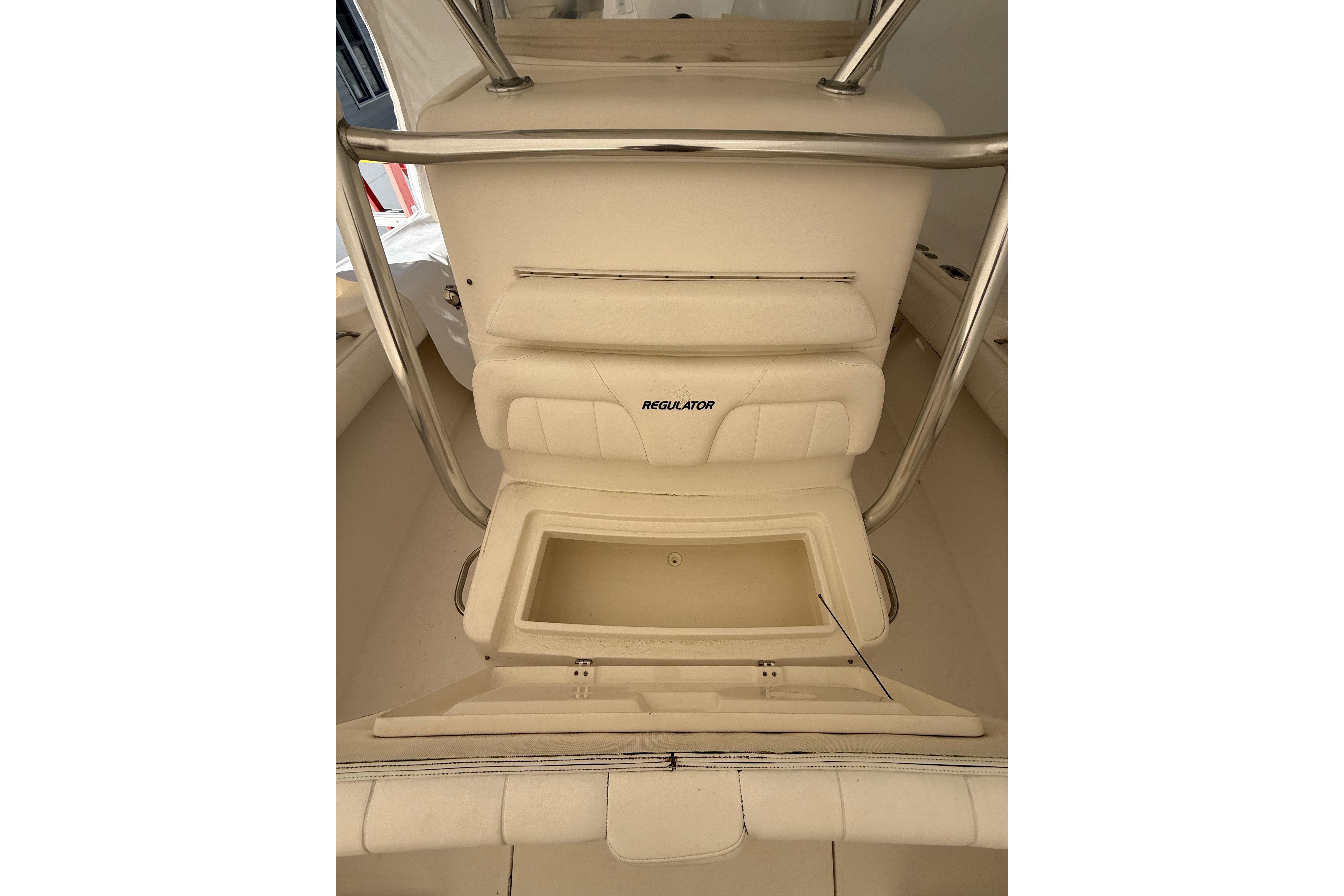 2015 Regulator 28 Forward Seating boat interior with storage compartment open.